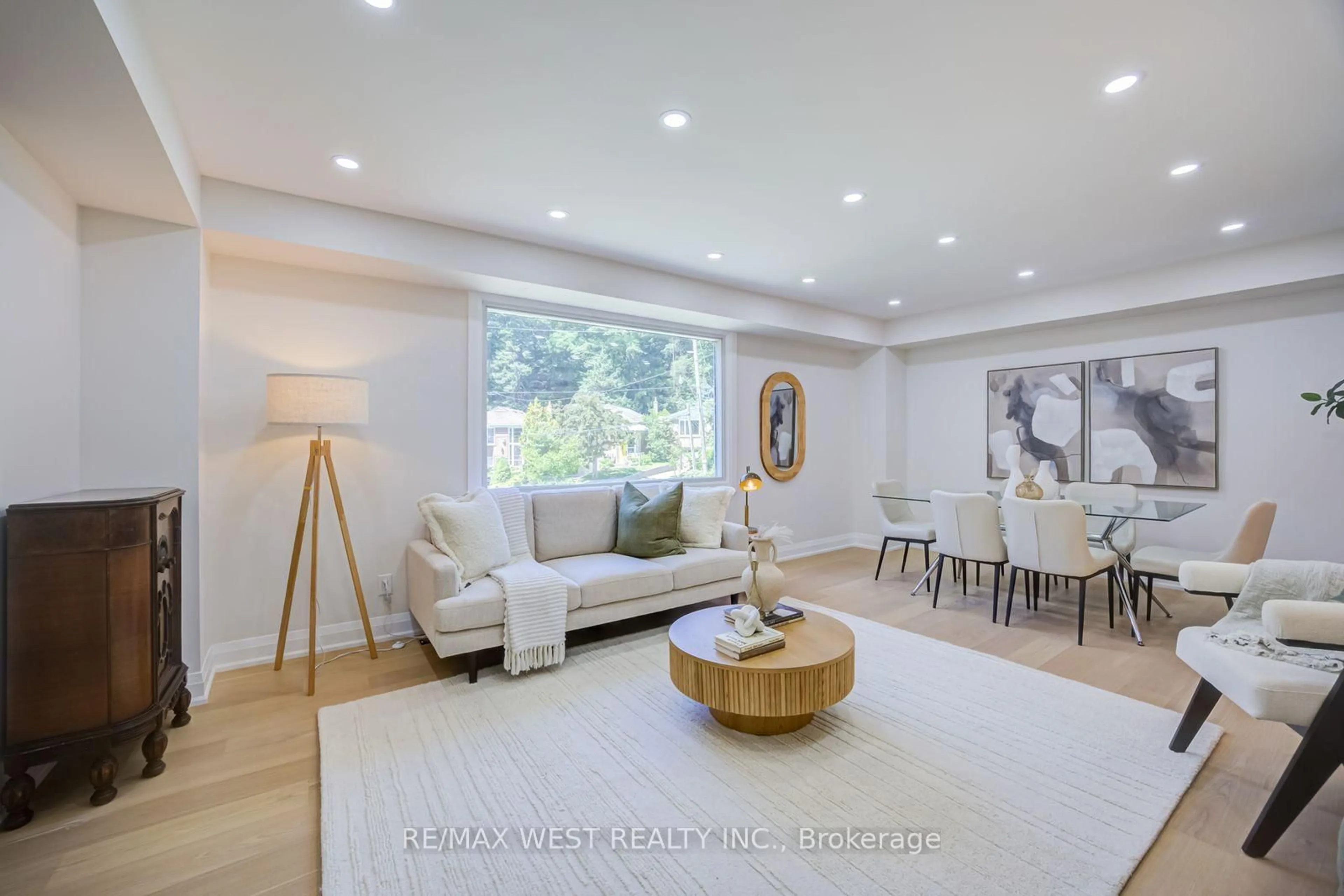 Living room with furniture, wood/laminate floor for 95 Glen Davis Cres, Toronto Ontario M4E 1X7