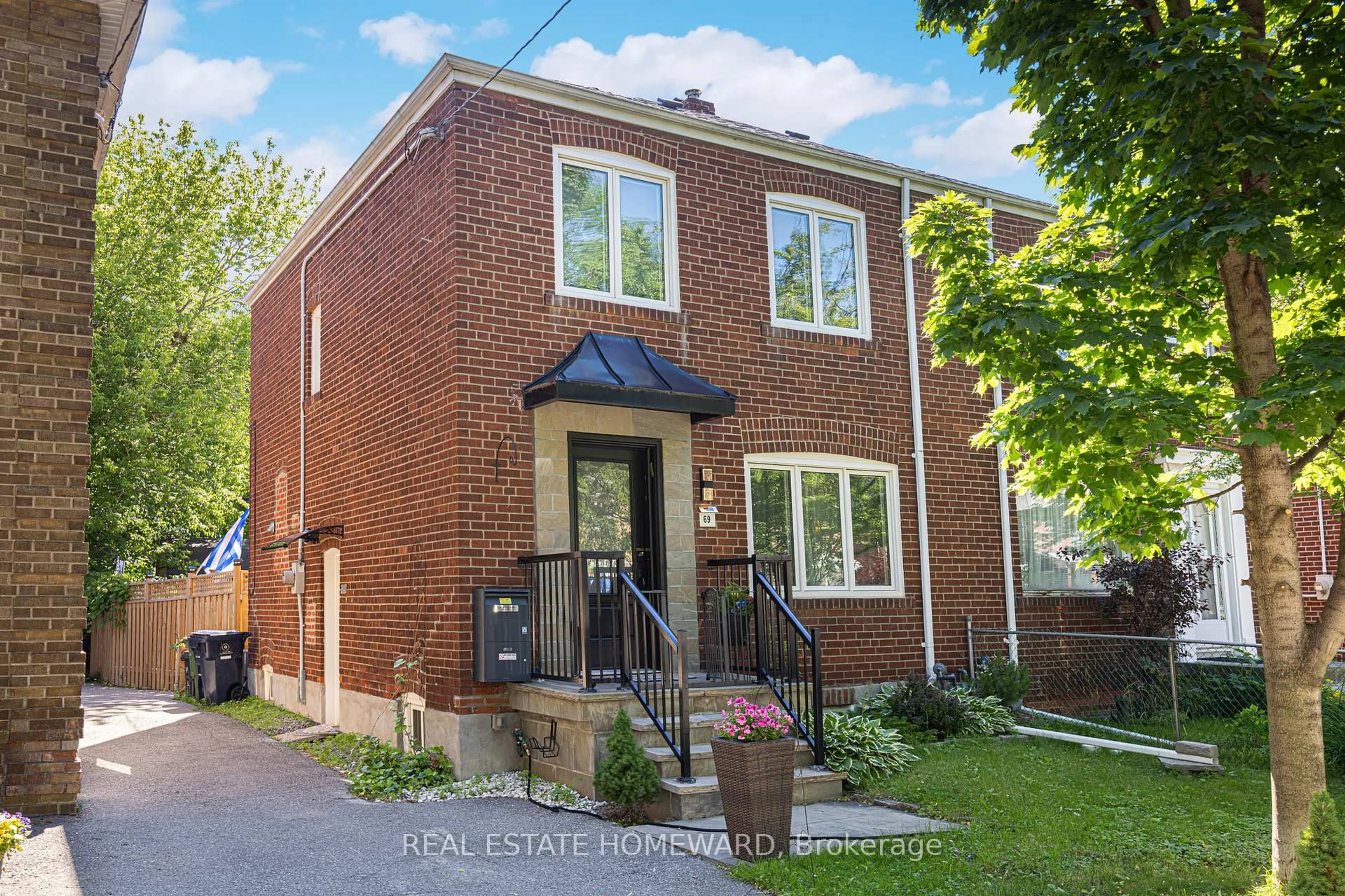 Home with brick exterior material, street for 69 Hertle Ave, Toronto Ontario M4L 2T3