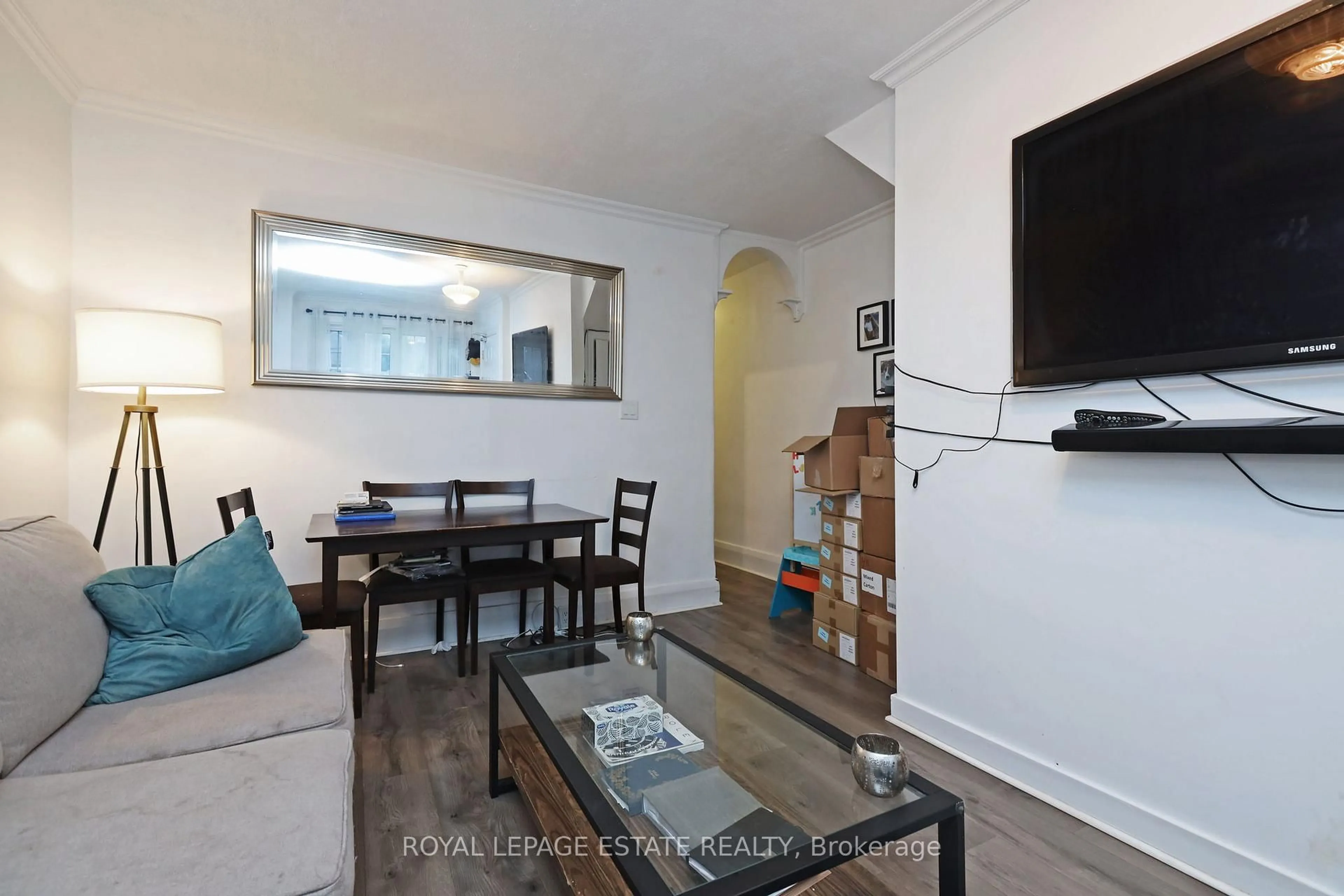 Living room with furniture, wood/laminate floor for 36 Meadow Ave, Toronto Ontario M1N 1V6