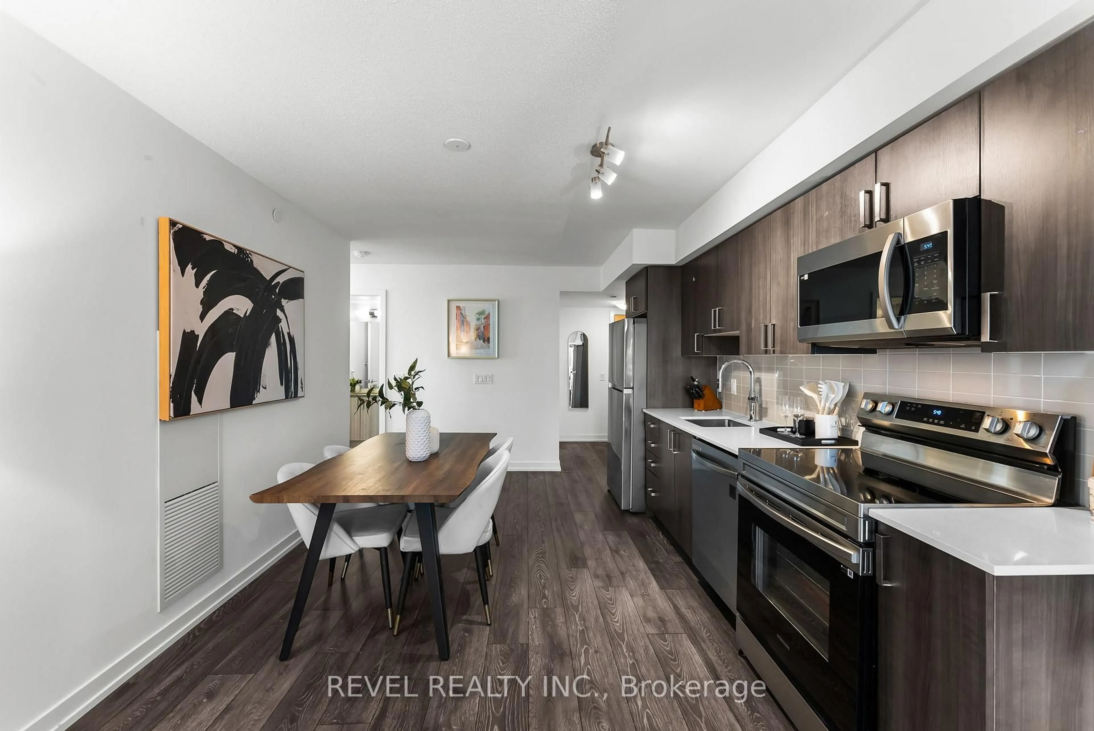 Open concept kitchen, wood/laminate floor for 1455 Celebration Dr #1704, Pickering Ontario L1W 0C3