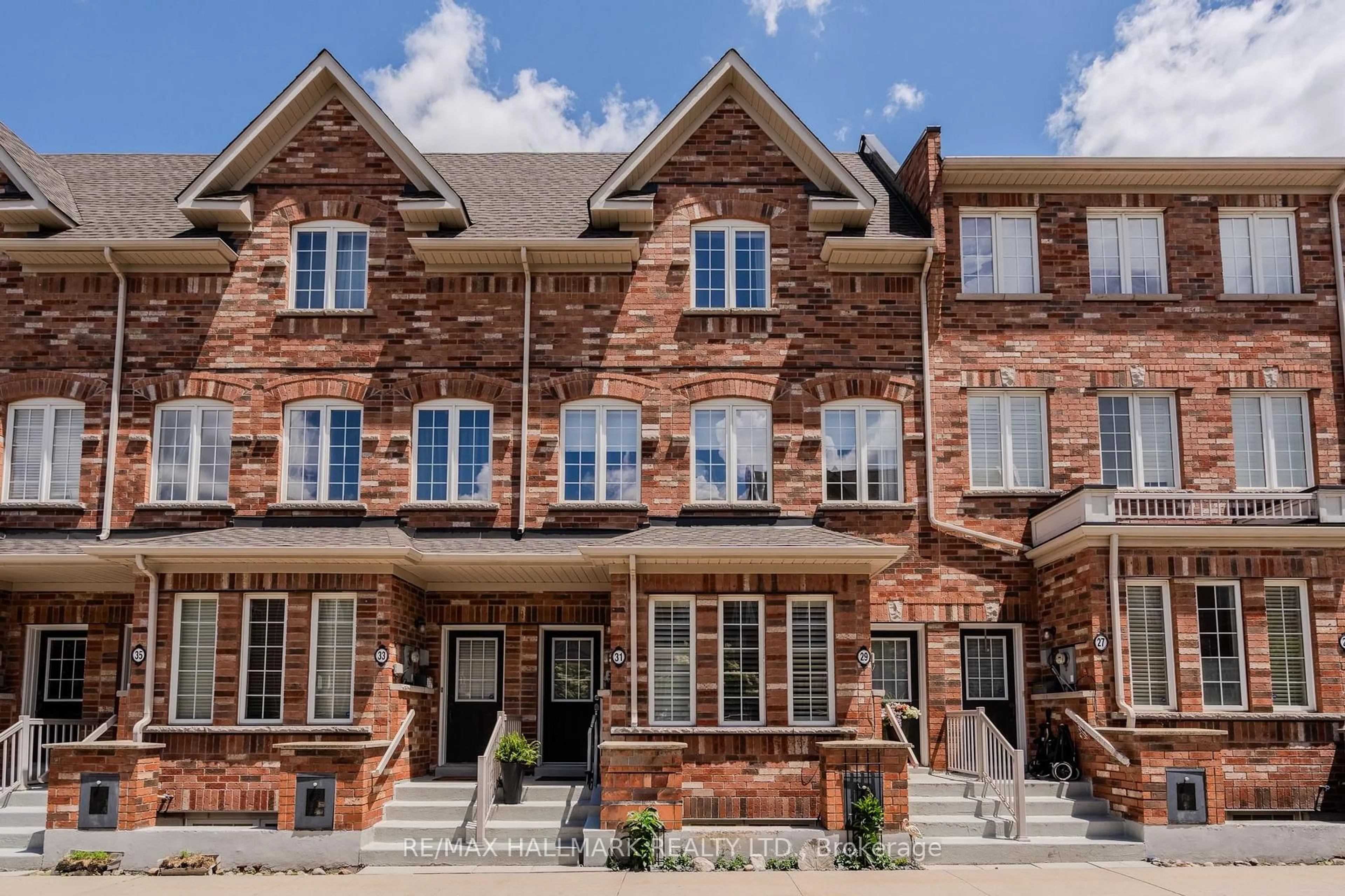 Home with brick exterior material, street for 31 Carnahan Terr, Toronto Ontario M4E 0B1