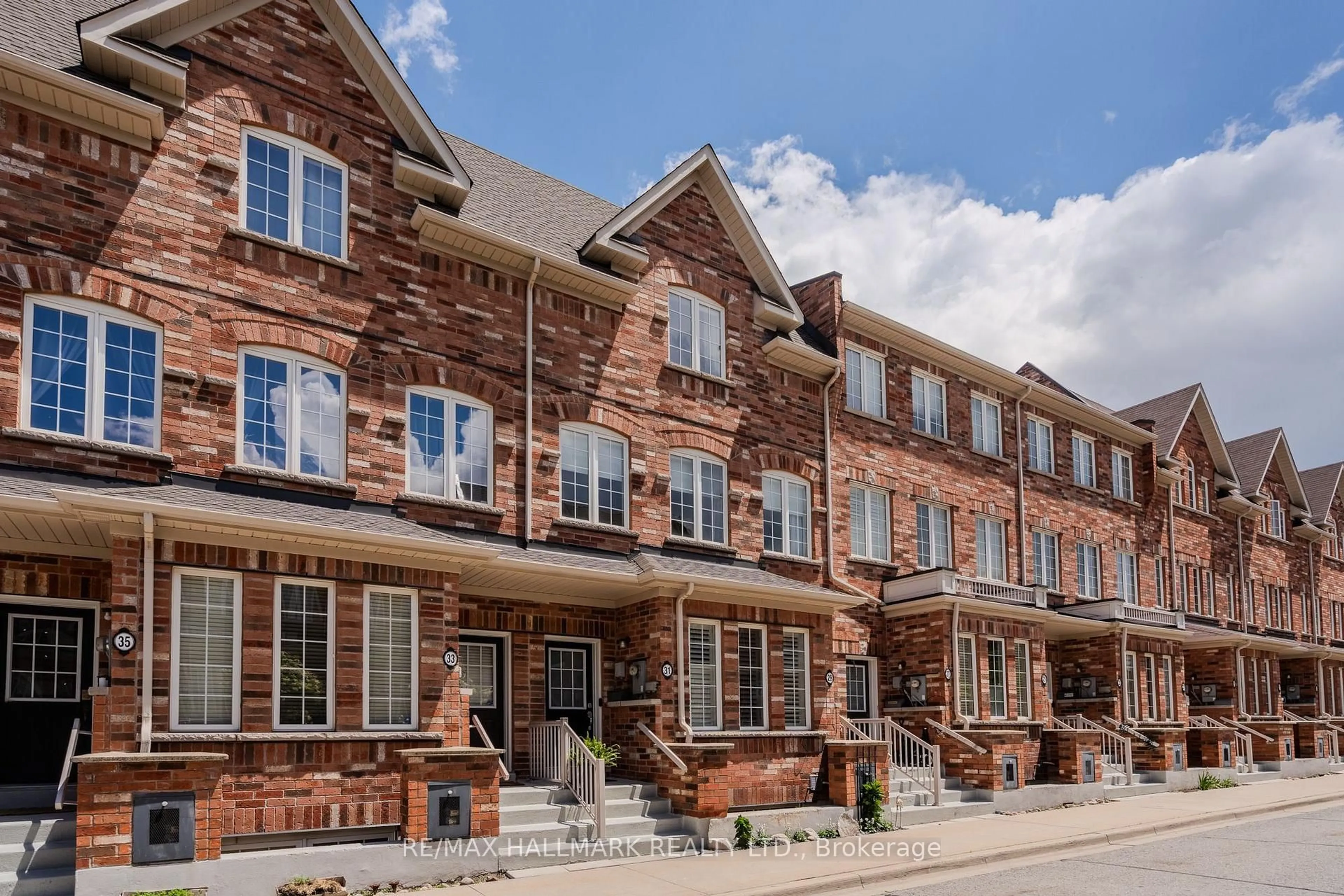 Home with brick exterior material, street for 31 Carnahan Terr, Toronto Ontario M4E 0B1