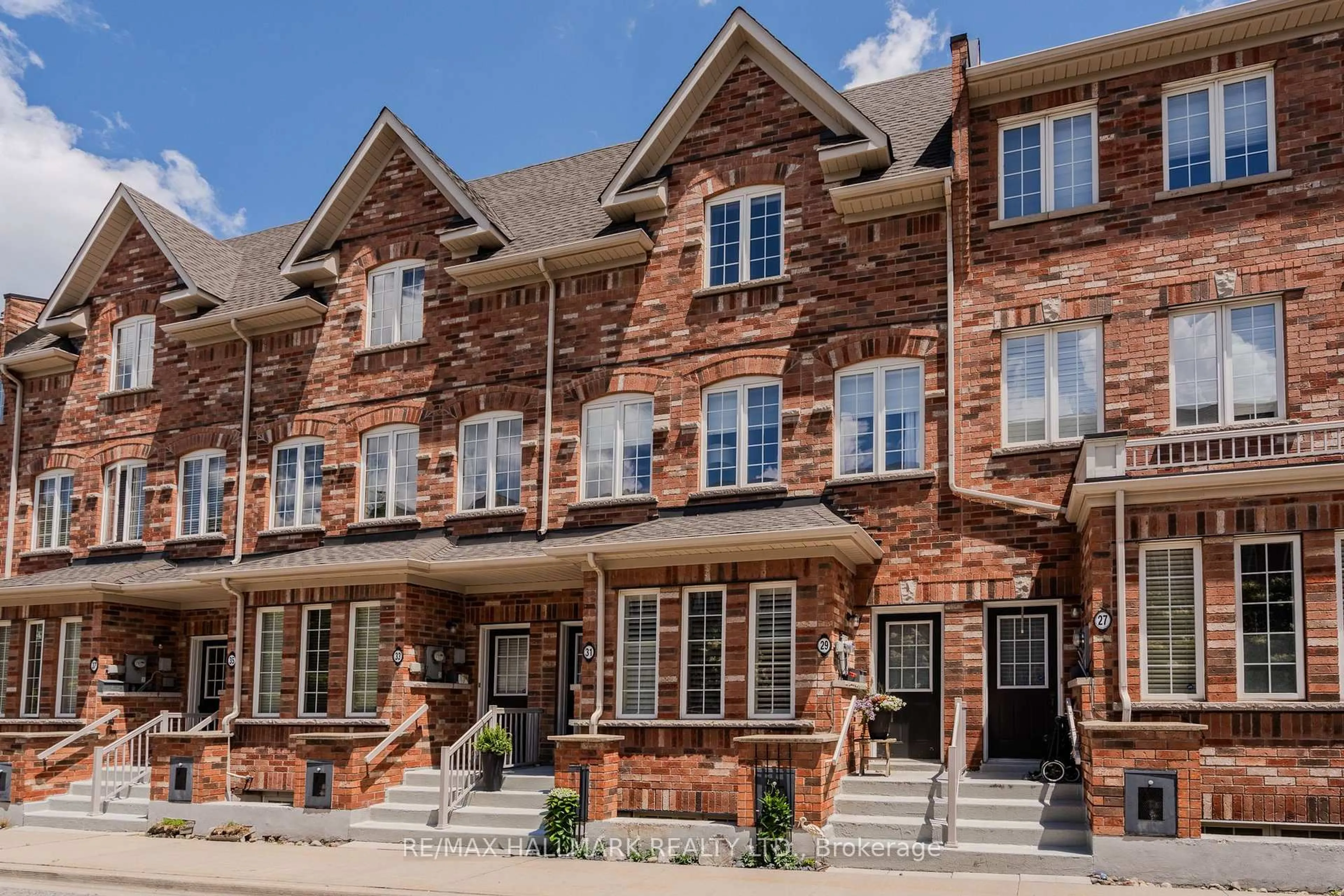Home with brick exterior material, street for 31 Carnahan Terr, Toronto Ontario M4E 0B1