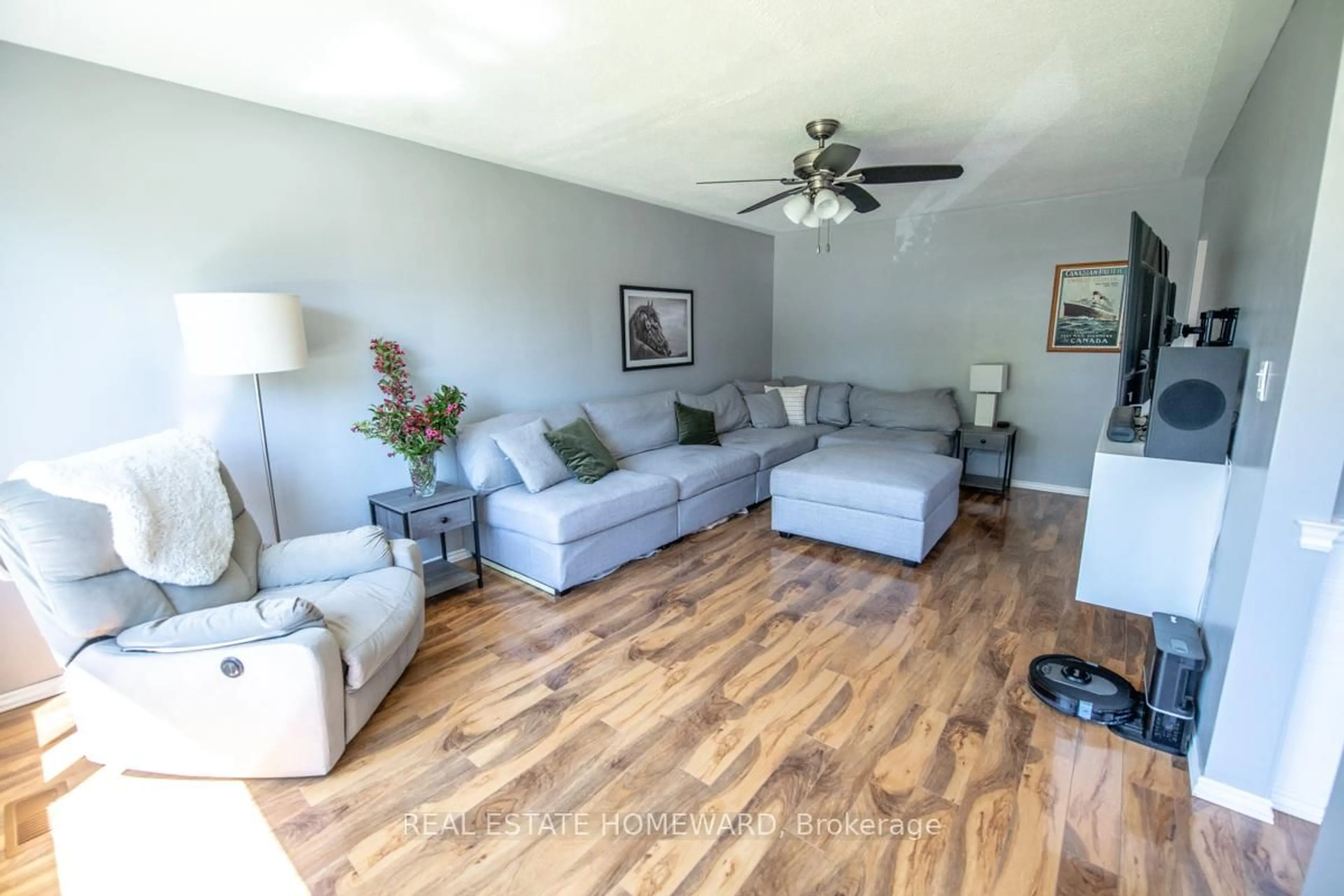 Living room with furniture, wood/laminate floor for 4 Sunicrest Blvd, Clarington Ontario L1C 2G7