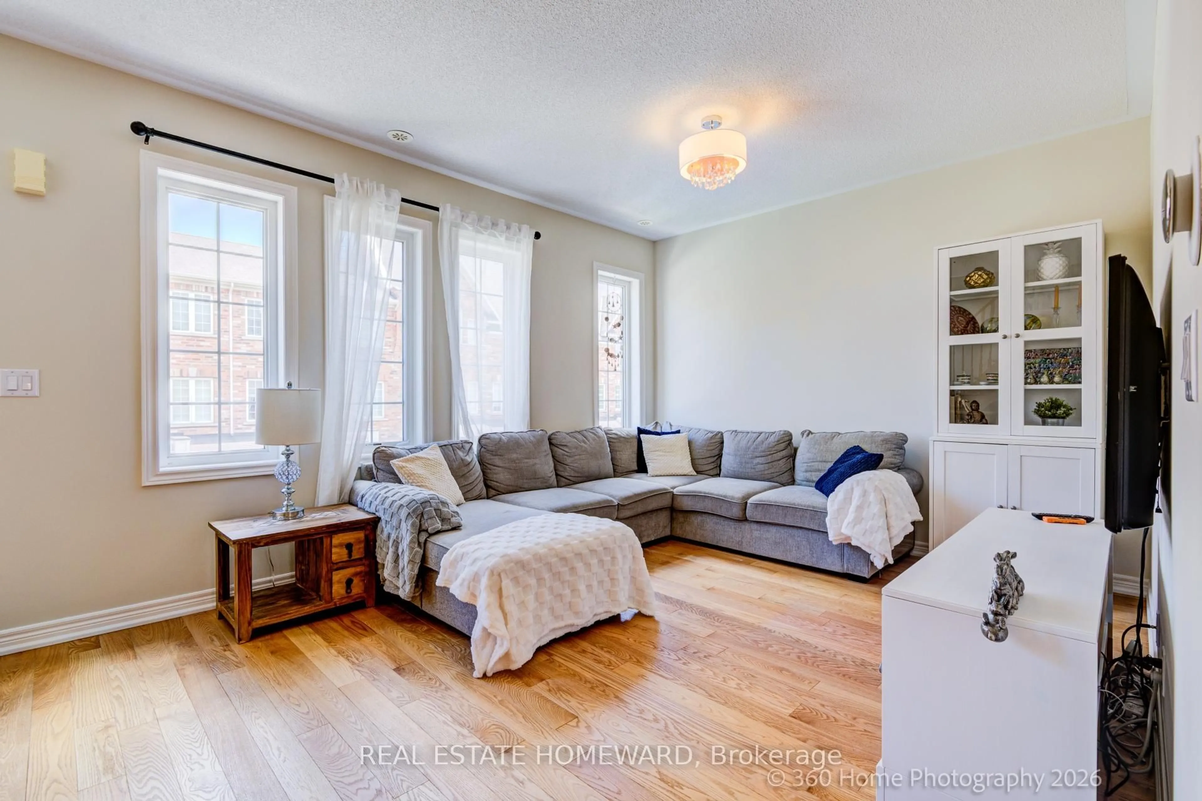 Living room with furniture, unknown for 28 Carnahan Terr, Toronto Ontario M4E 0B2