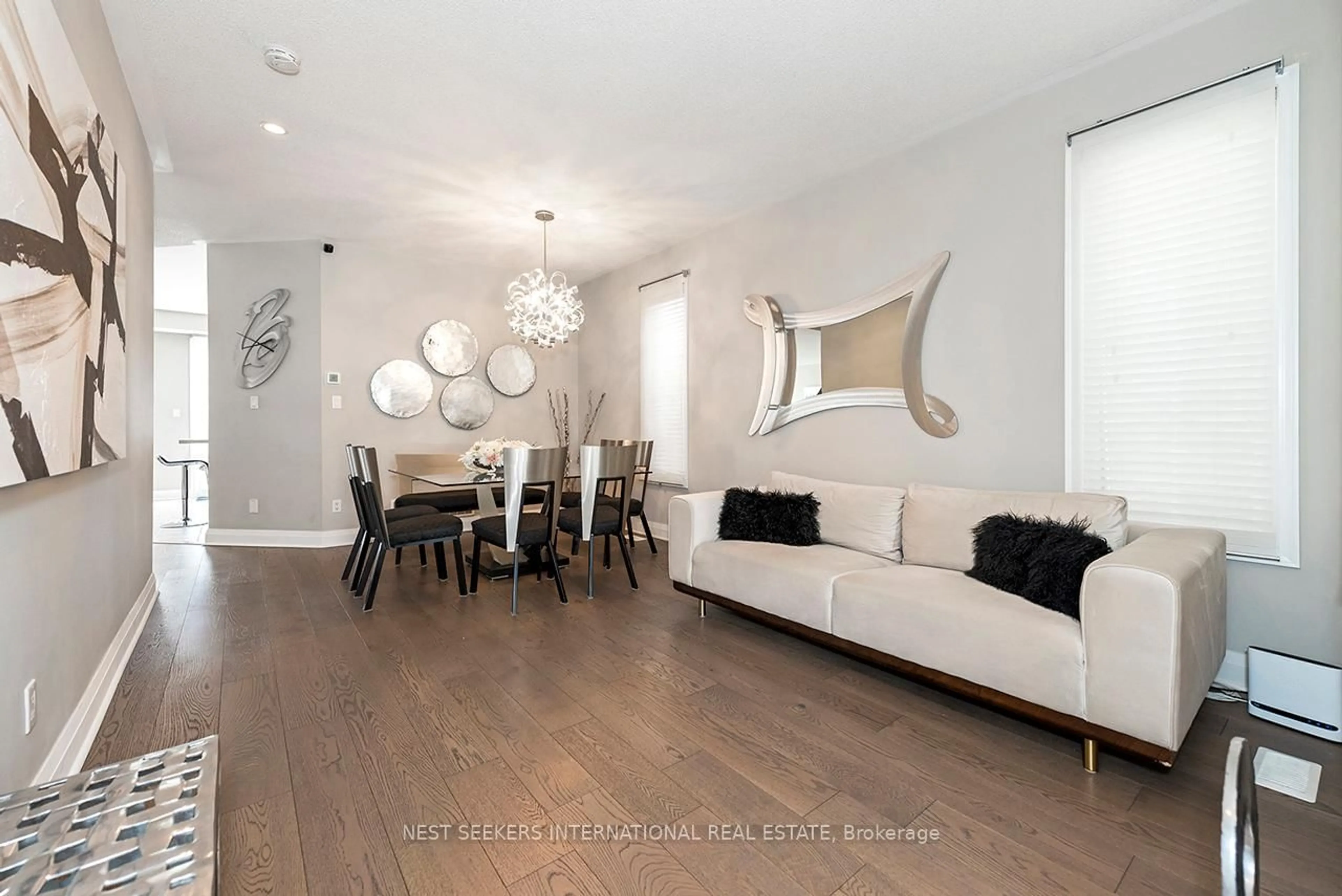 Living room with furniture, wood/laminate floor for 11 Bambridge St, Ajax Ontario L1Z 1R4