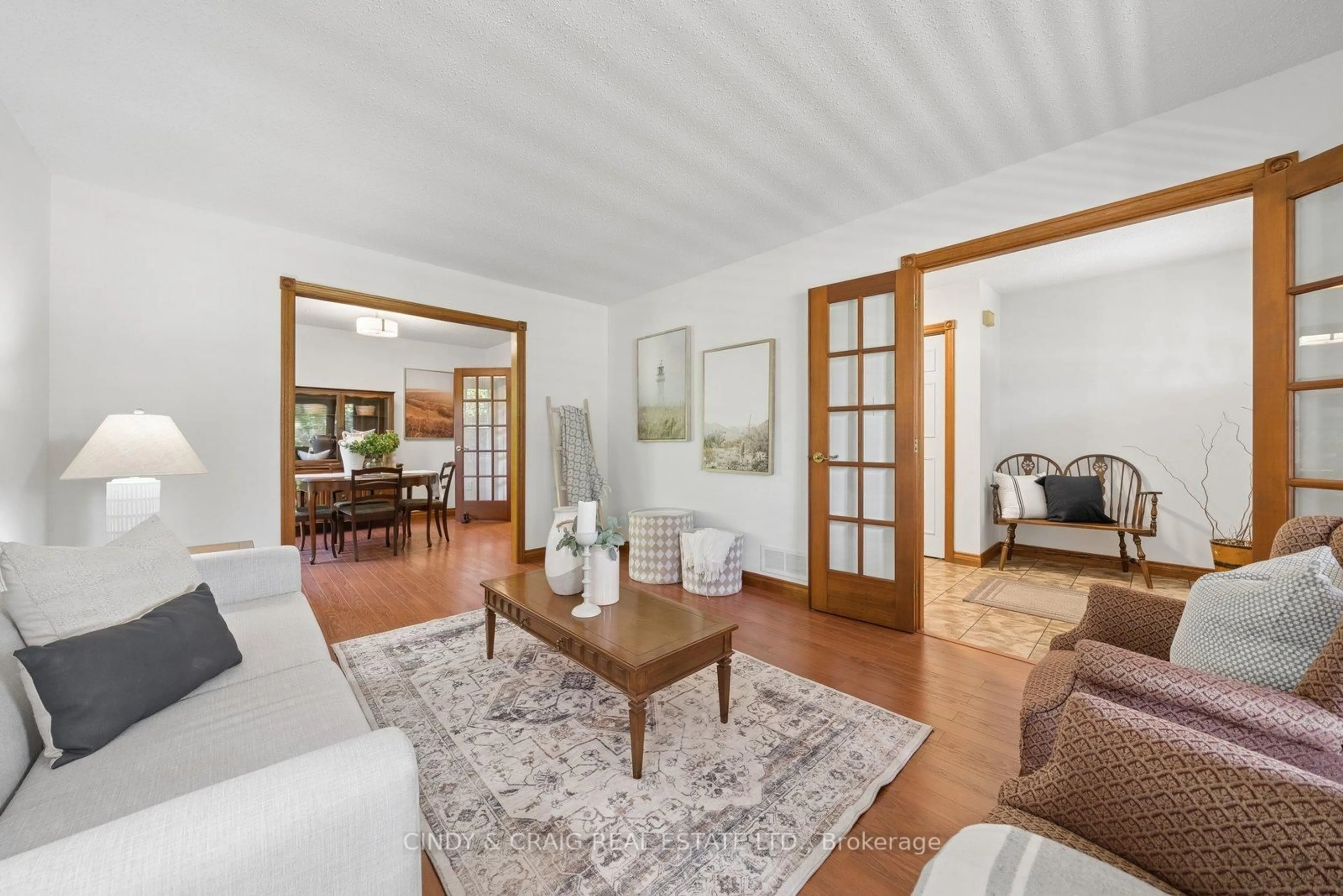 Living room with furniture, wood/laminate floor for 34 Cloverfield St, Clarington Ontario L1E 1K4