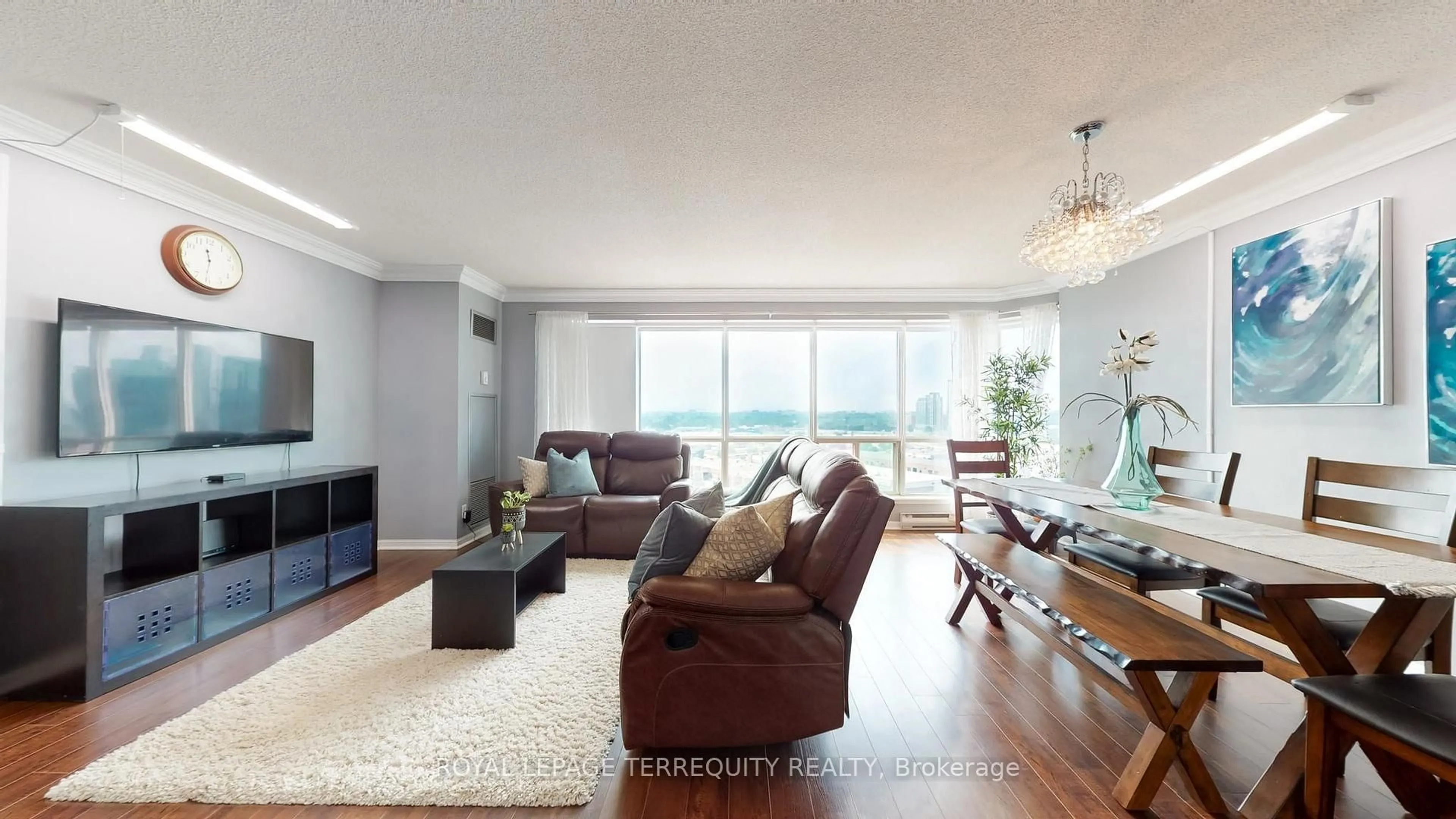 Living room with furniture, wood/laminate floor for 18 Lee Centre Dr #1506, Toronto Ontario M1H 3H5