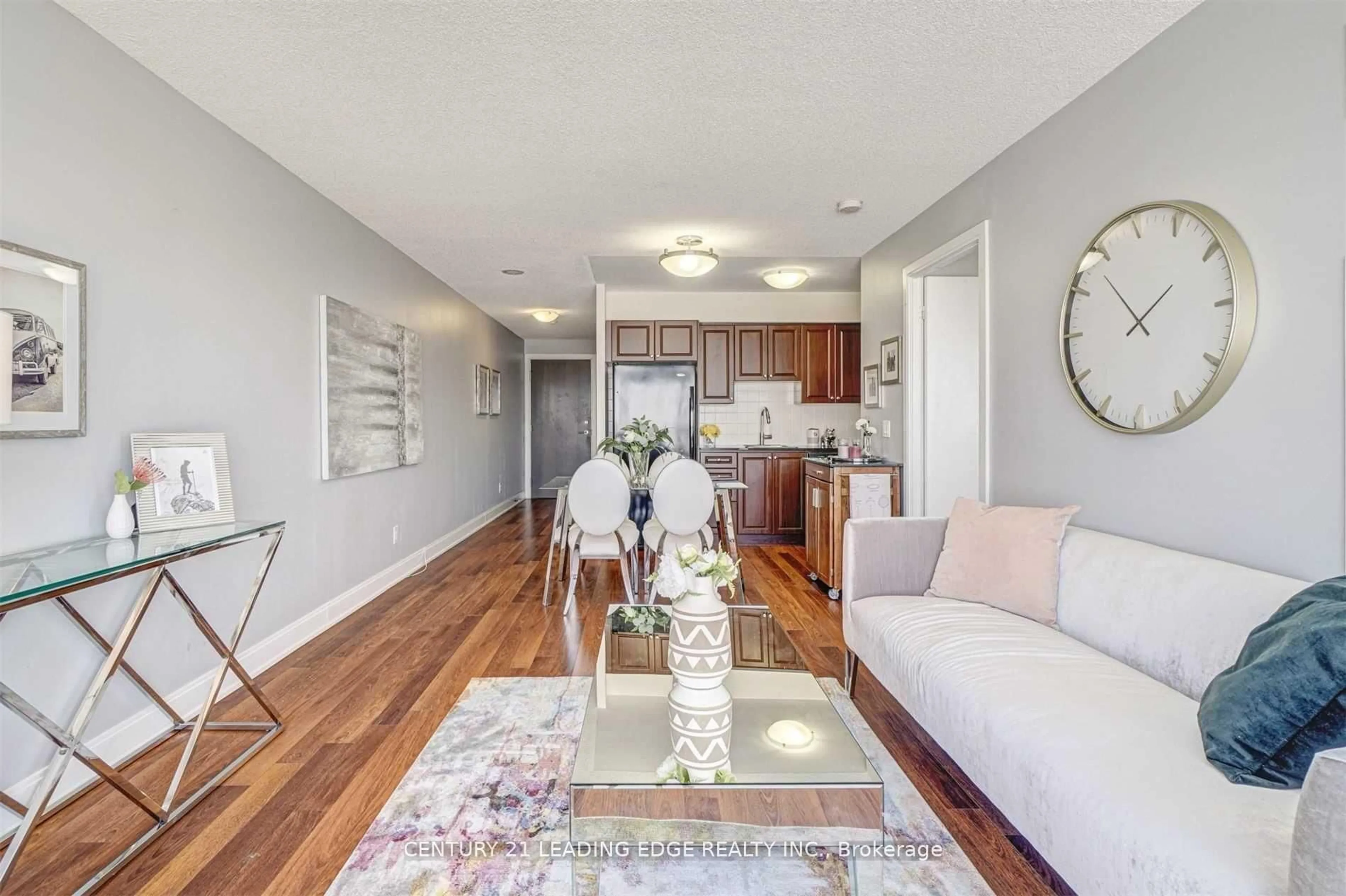 Living room with furniture, wood/laminate floor for 135 Village Green Sq #2415, Toronto Ontario M1S 0G4