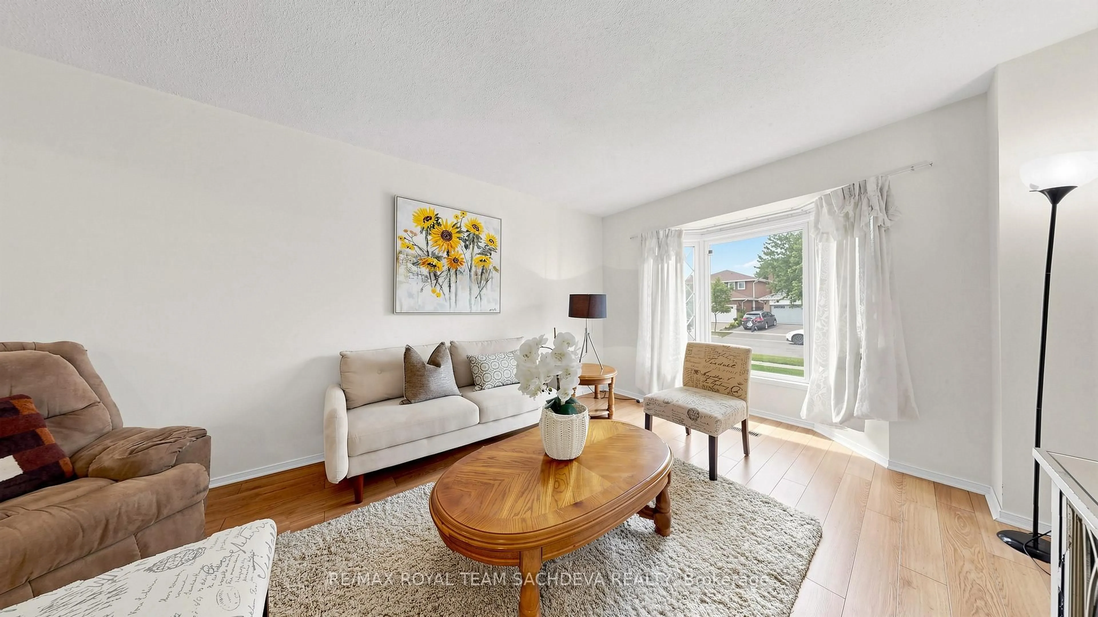 Living room with furniture, wood/laminate floor for 44 Calverley Tr, Toronto Ontario M1C 3R5