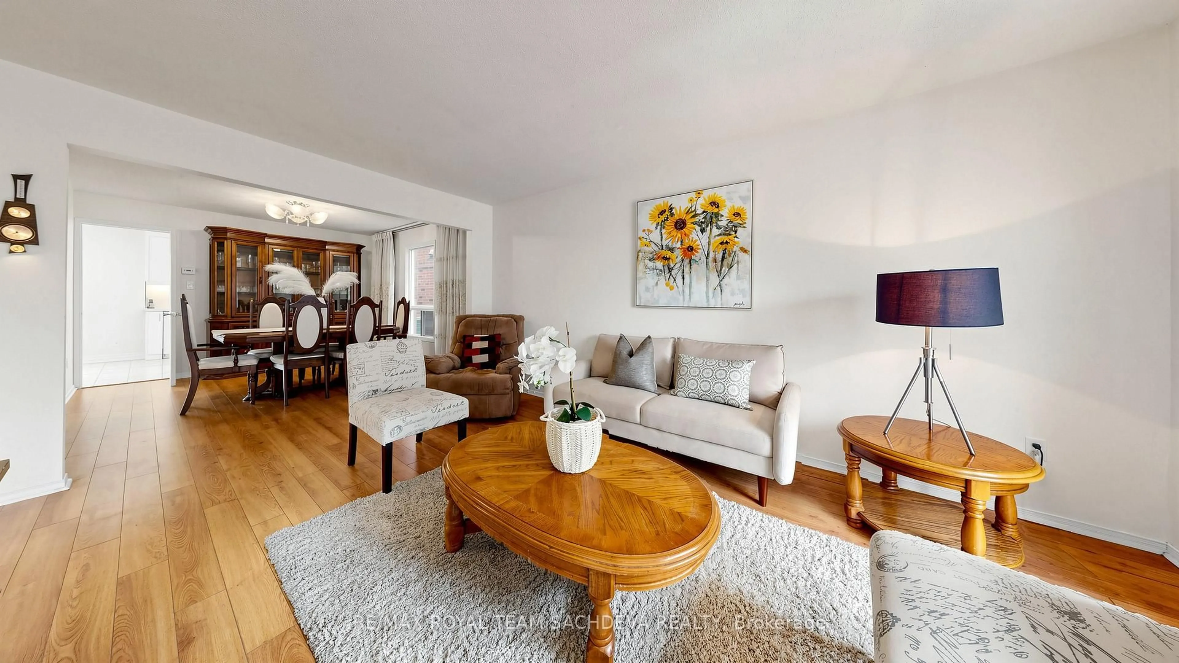 Living room with furniture, wood/laminate floor for 44 Calverley Tr, Toronto Ontario M1C 3R5