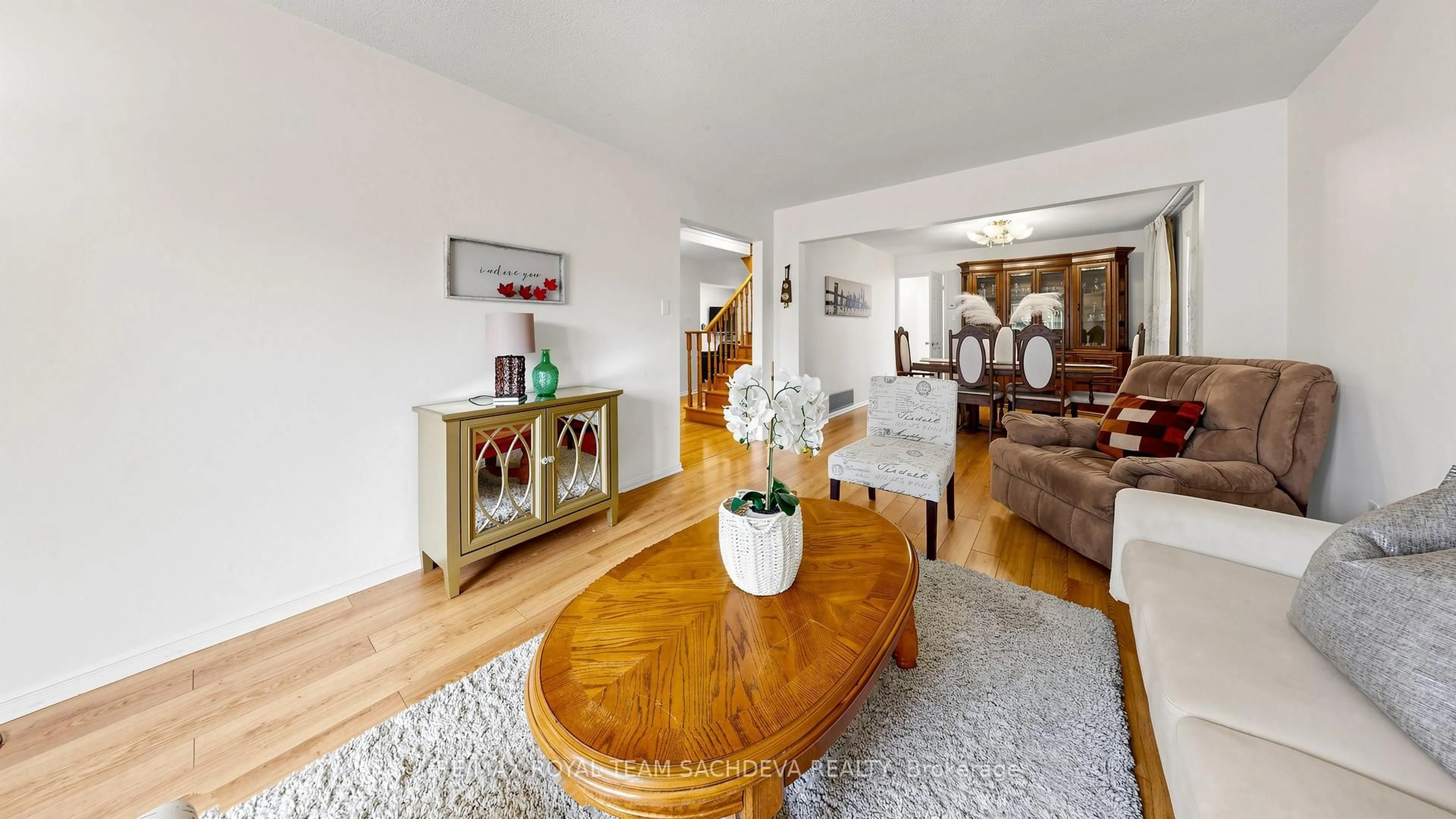 Living room with furniture, wood/laminate floor for 44 Calverley Tr, Toronto Ontario M1C 3R5