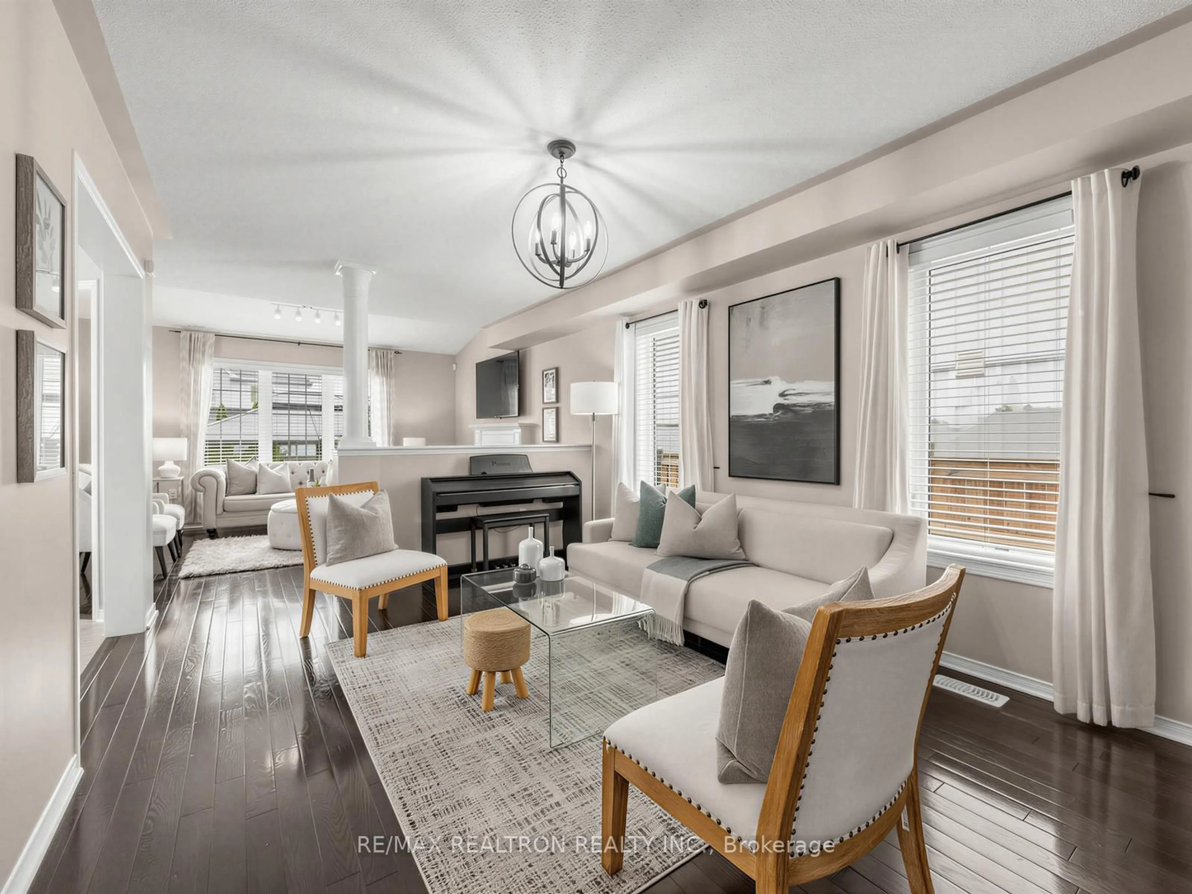 Living room with furniture, wood/laminate floor for 1089 Edward Bolton Cres, Oshawa Ontario L1K 0T7