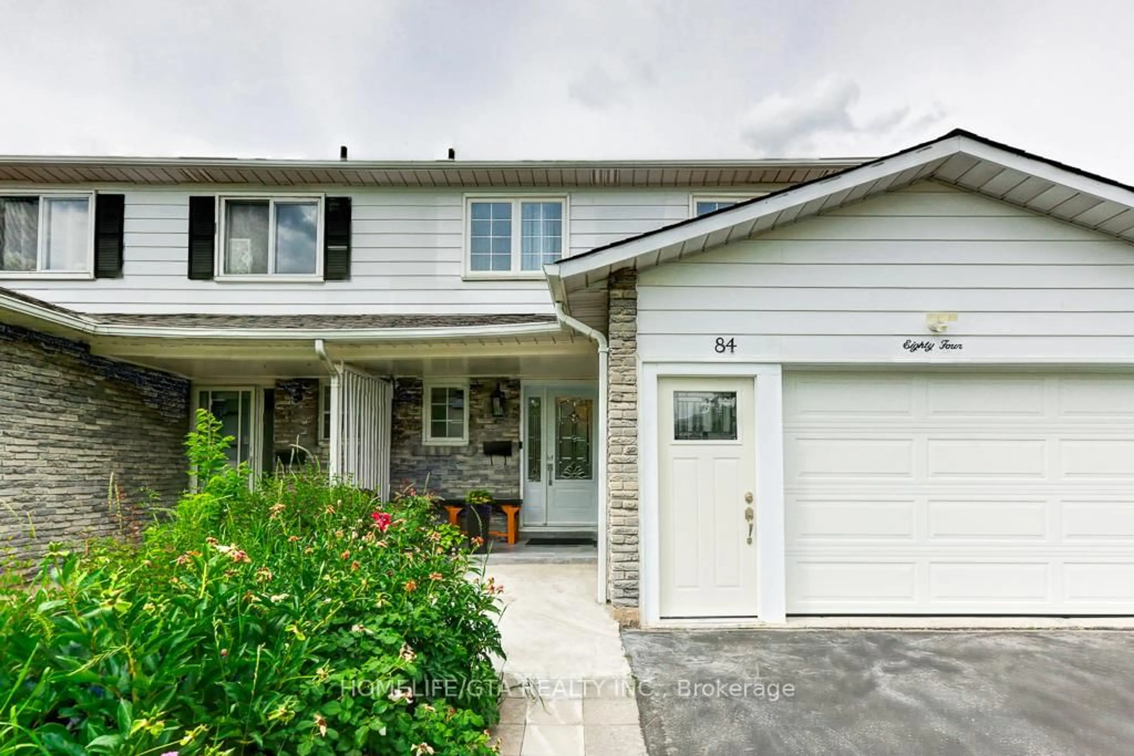 Home with vinyl exterior material, street for 84 Nortonville Dr, Toronto Ontario M1T 2G8