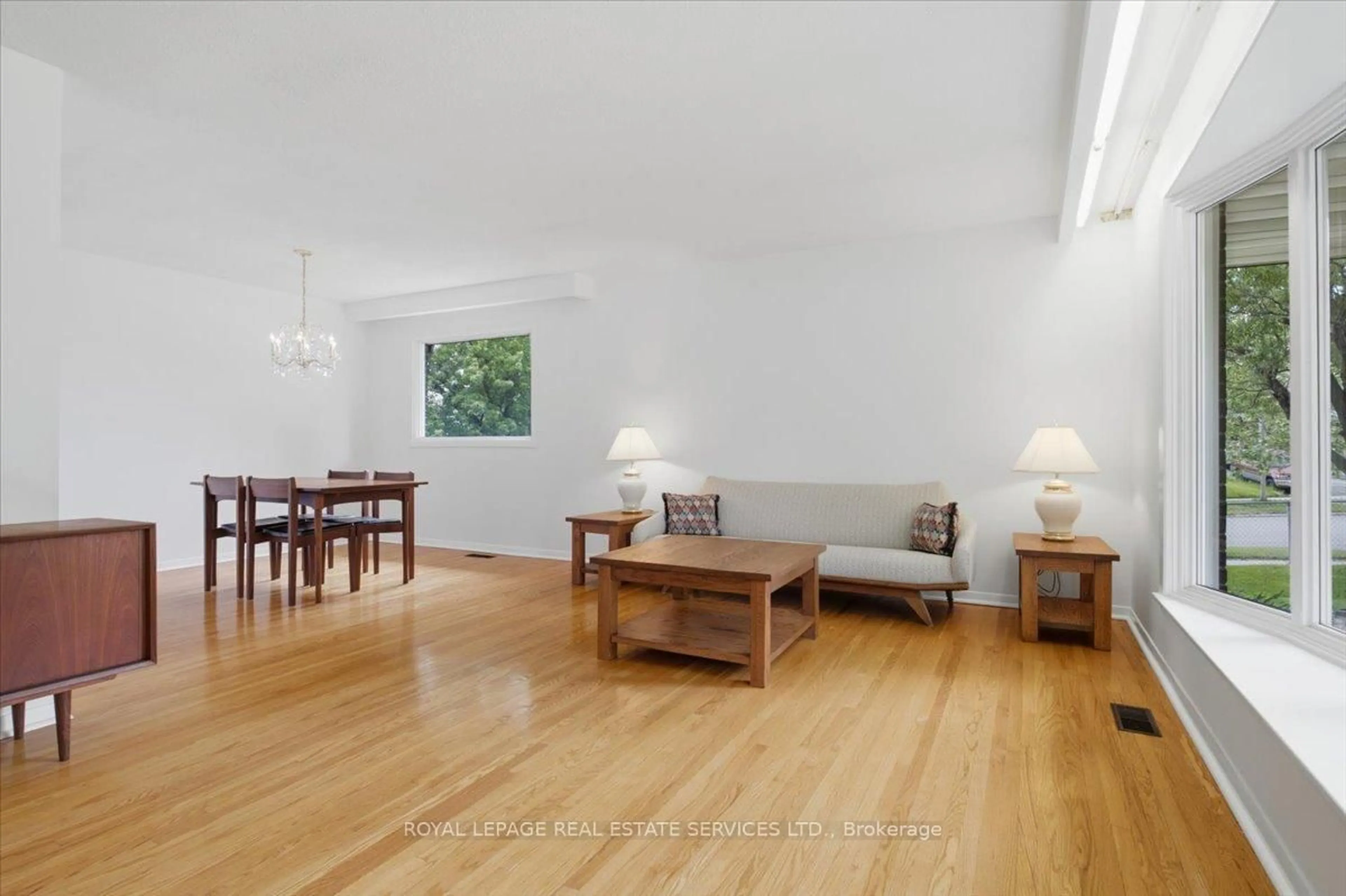 Living room with furniture, wood/laminate floor for 1 Rosegrove Pl, Toronto Ontario M1S 1W5
