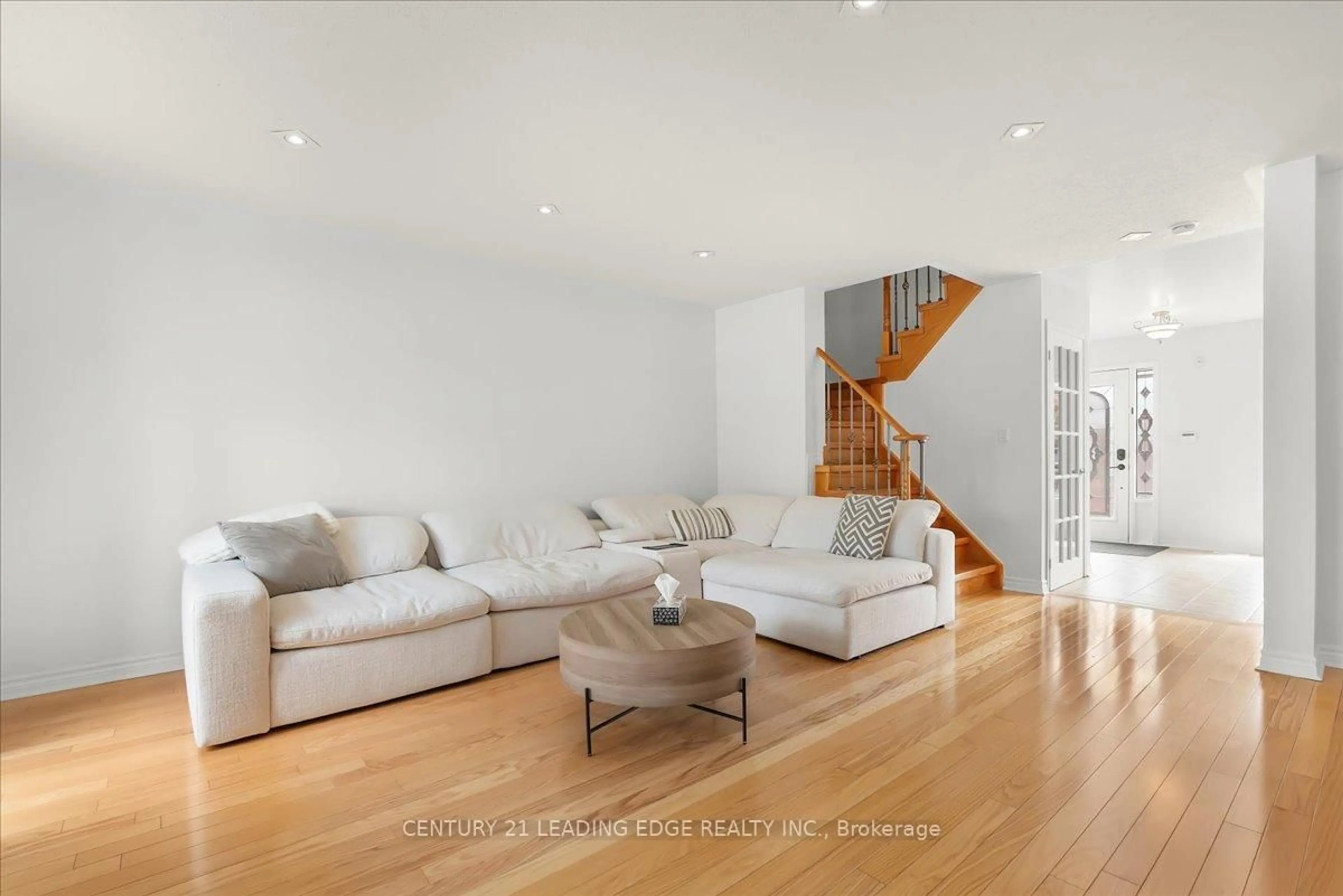 Living room with furniture, wood/laminate floor for 46 Georgina Gate, Toronto Ontario M1L 4T9