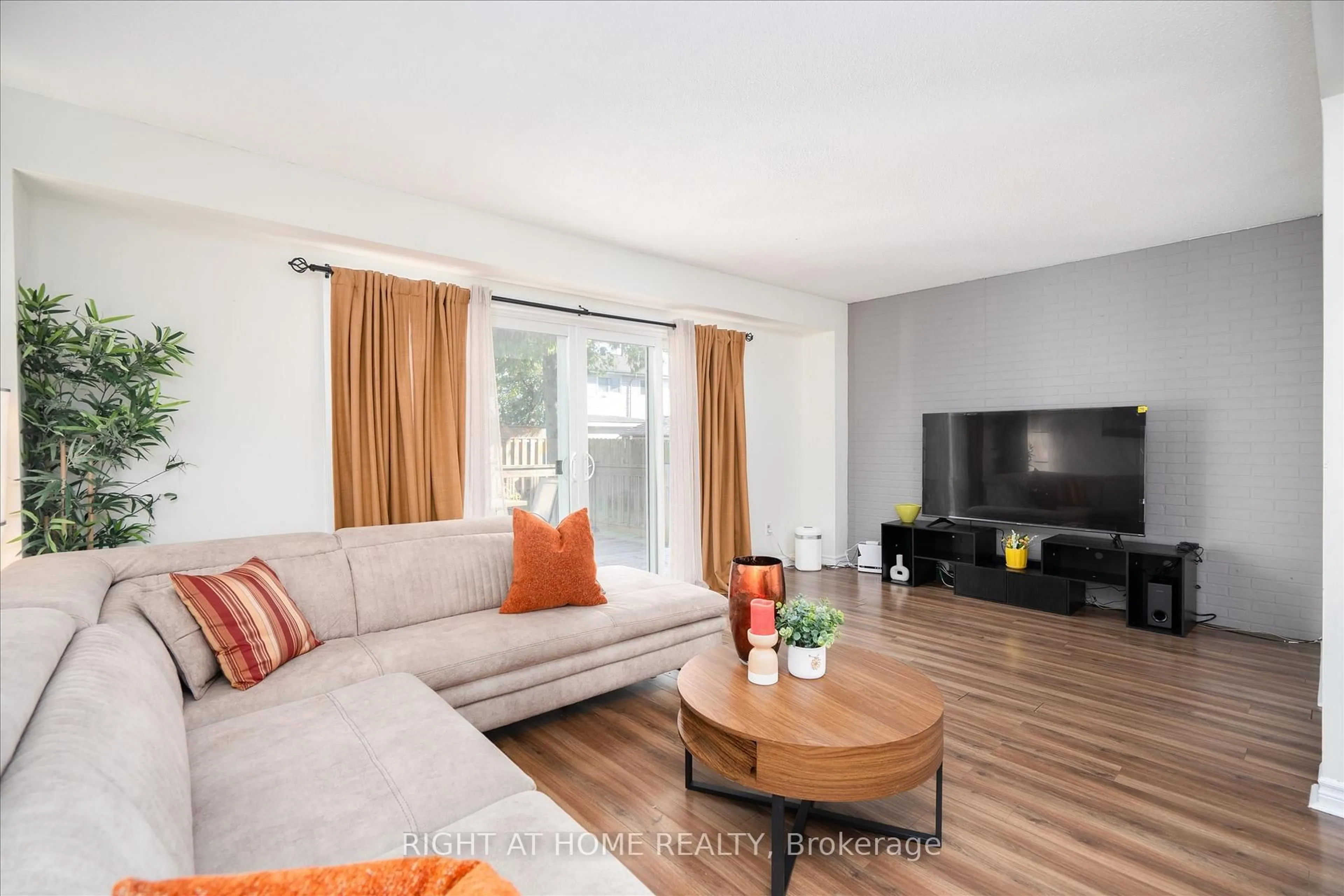 Living room with furniture, wood/laminate floor for 1306 Fenelon Cres, Oshawa Ontario L1J 6G1