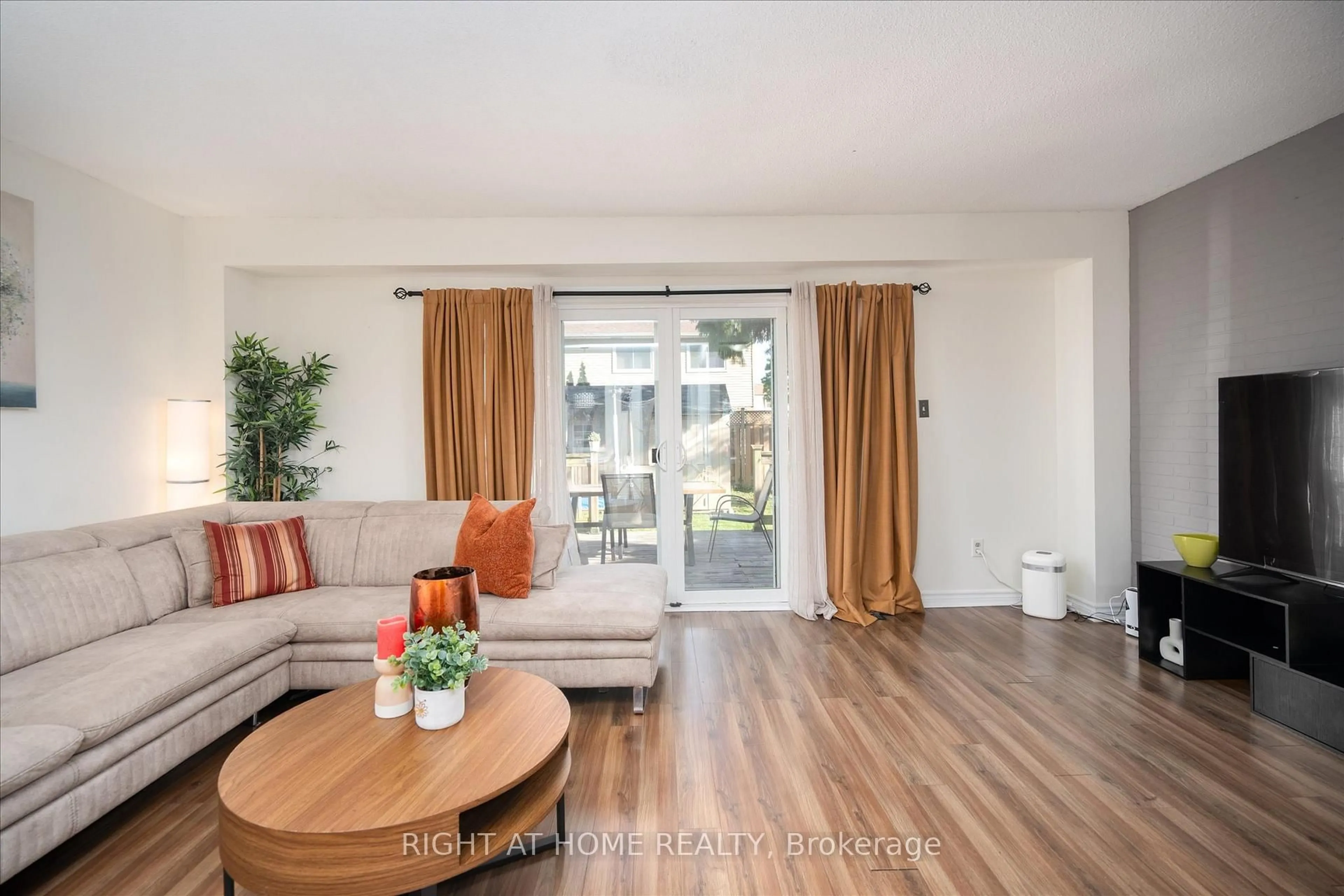 Living room with furniture, wood/laminate floor for 1306 Fenelon Cres, Oshawa Ontario L1J 6G1