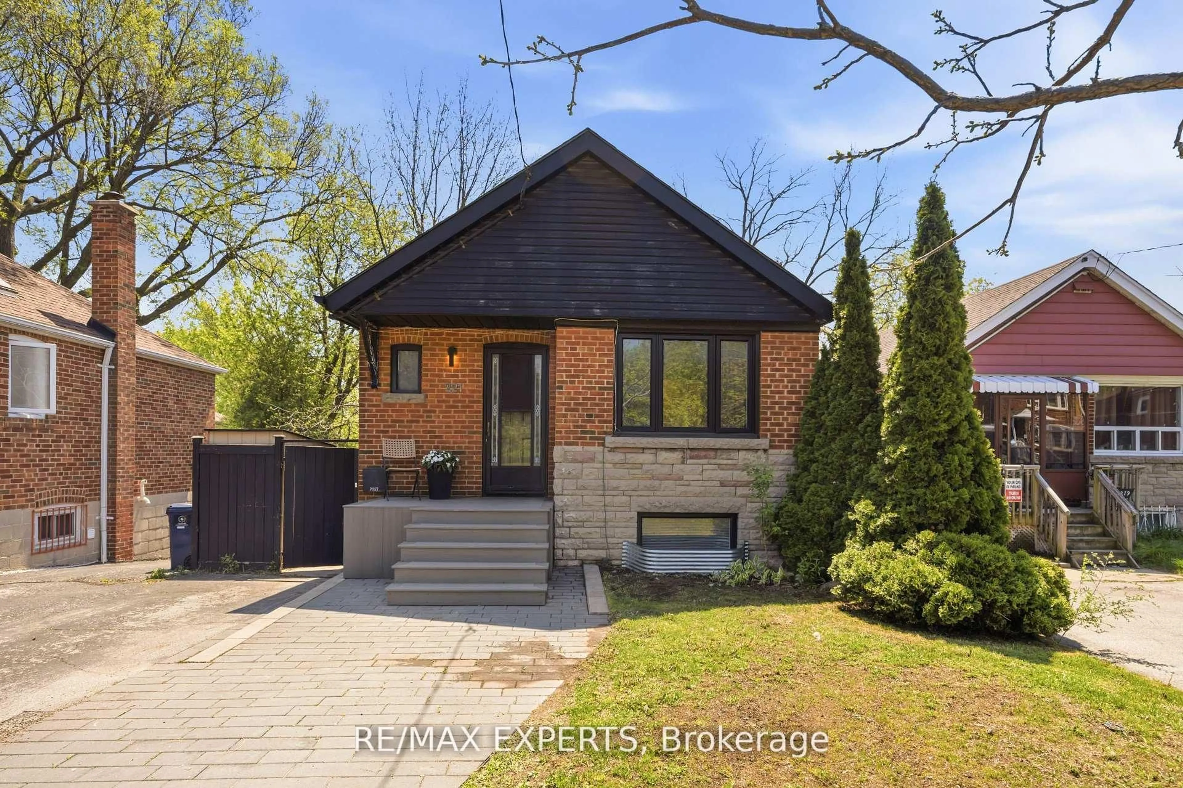 Home with brick exterior material, street for 221 Clonmore Dr, Toronto Ontario M1N 1Y4