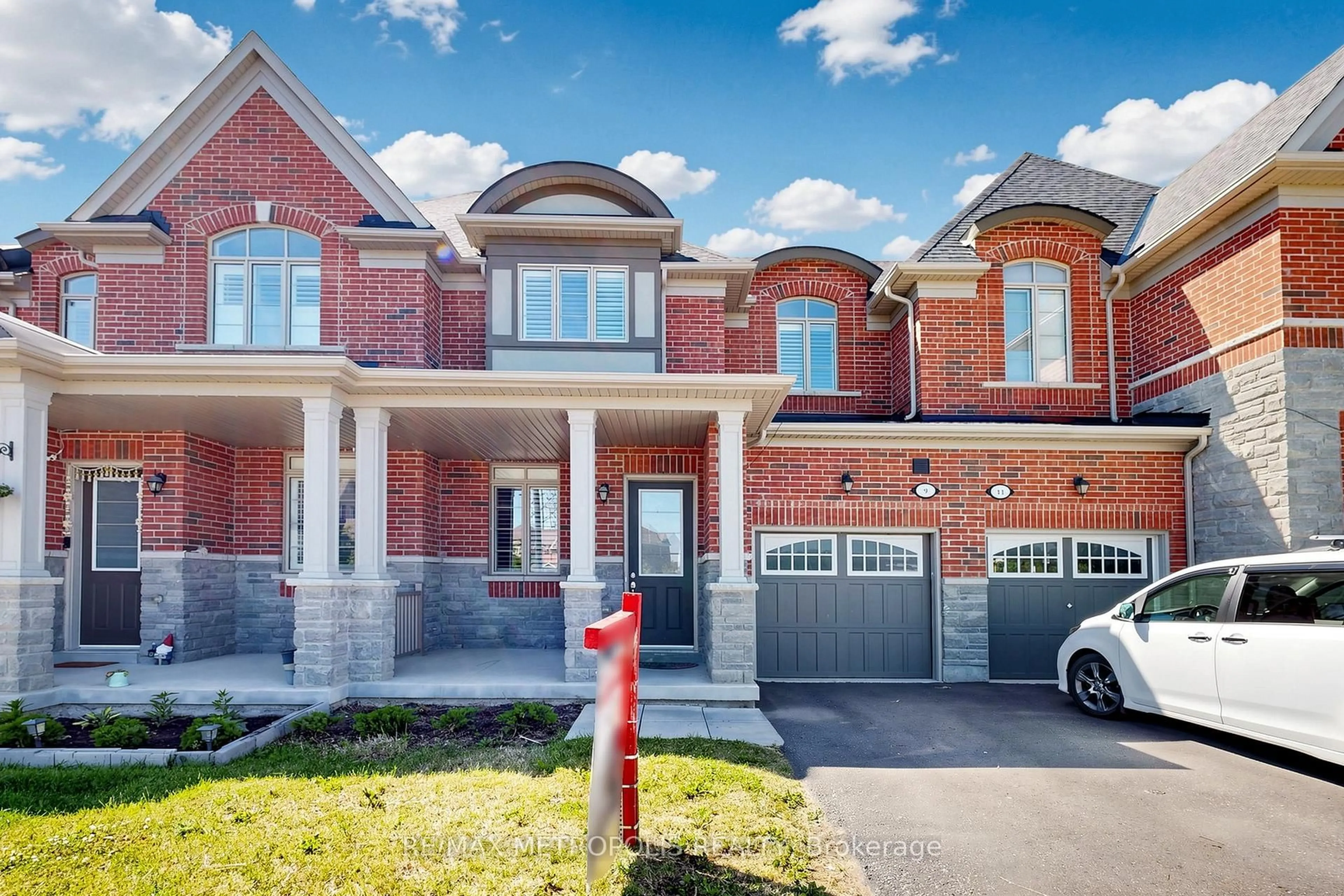 Home with brick exterior material, street for 9 Caton Lane, Ajax Ontario L1T 0P8
