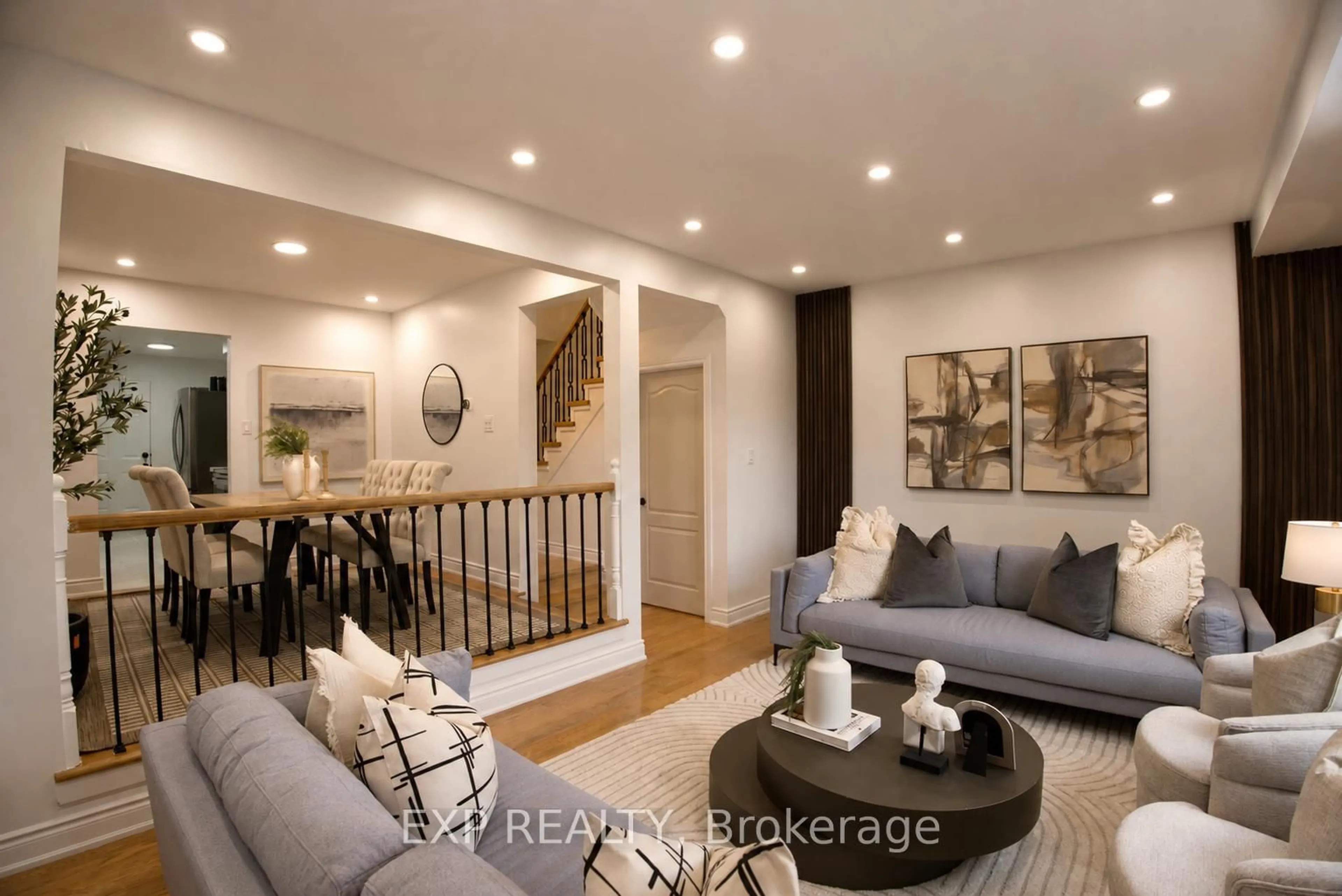 Living room with furniture, wood/laminate floor for 58 Wayford Cres, Toronto Ontario M1B 3E3