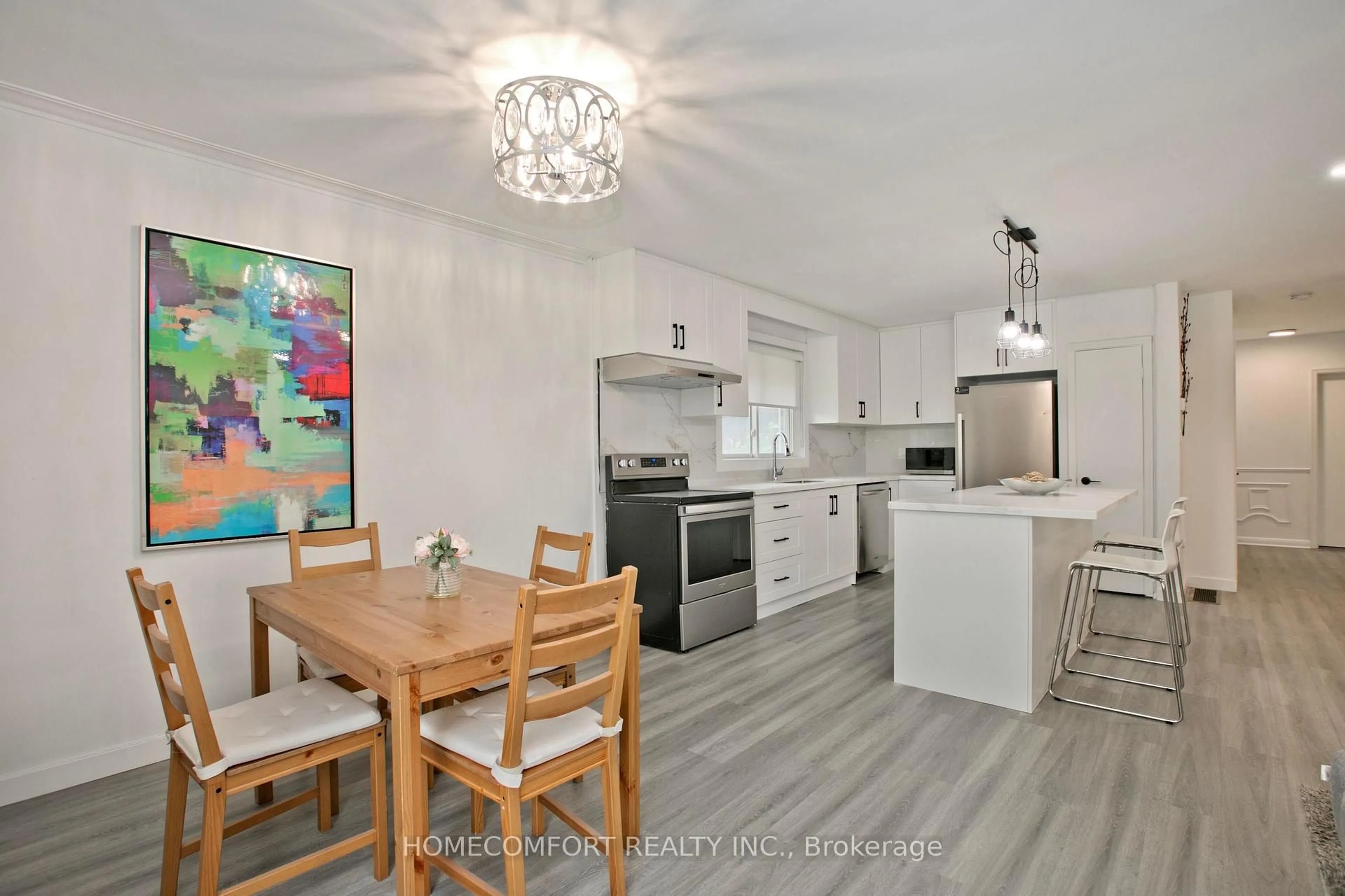 Open concept kitchen, wood/laminate floor for 19 Beacham Cres, Toronto Ontario M1T 1M9
