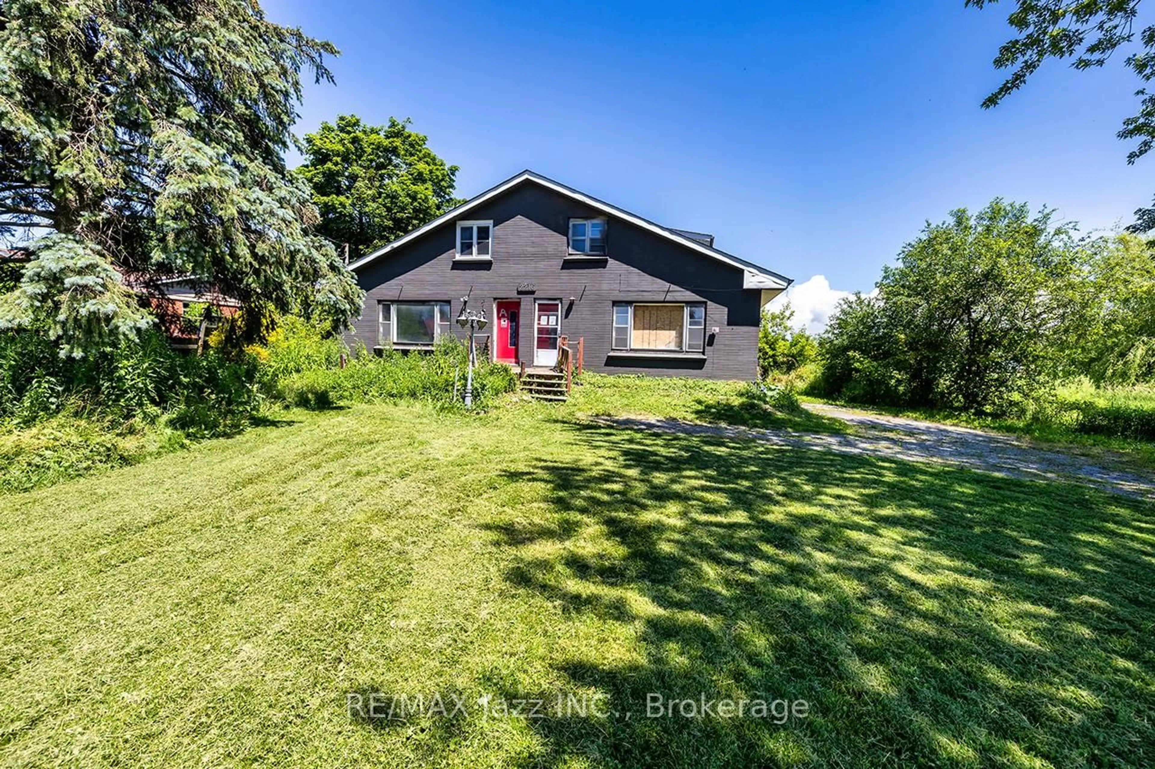A pic from outside/outdoor area/front of a property/back of a property/a pic from drone, street for 2216 Highway 2, Clarington Ontario L1C 6C3