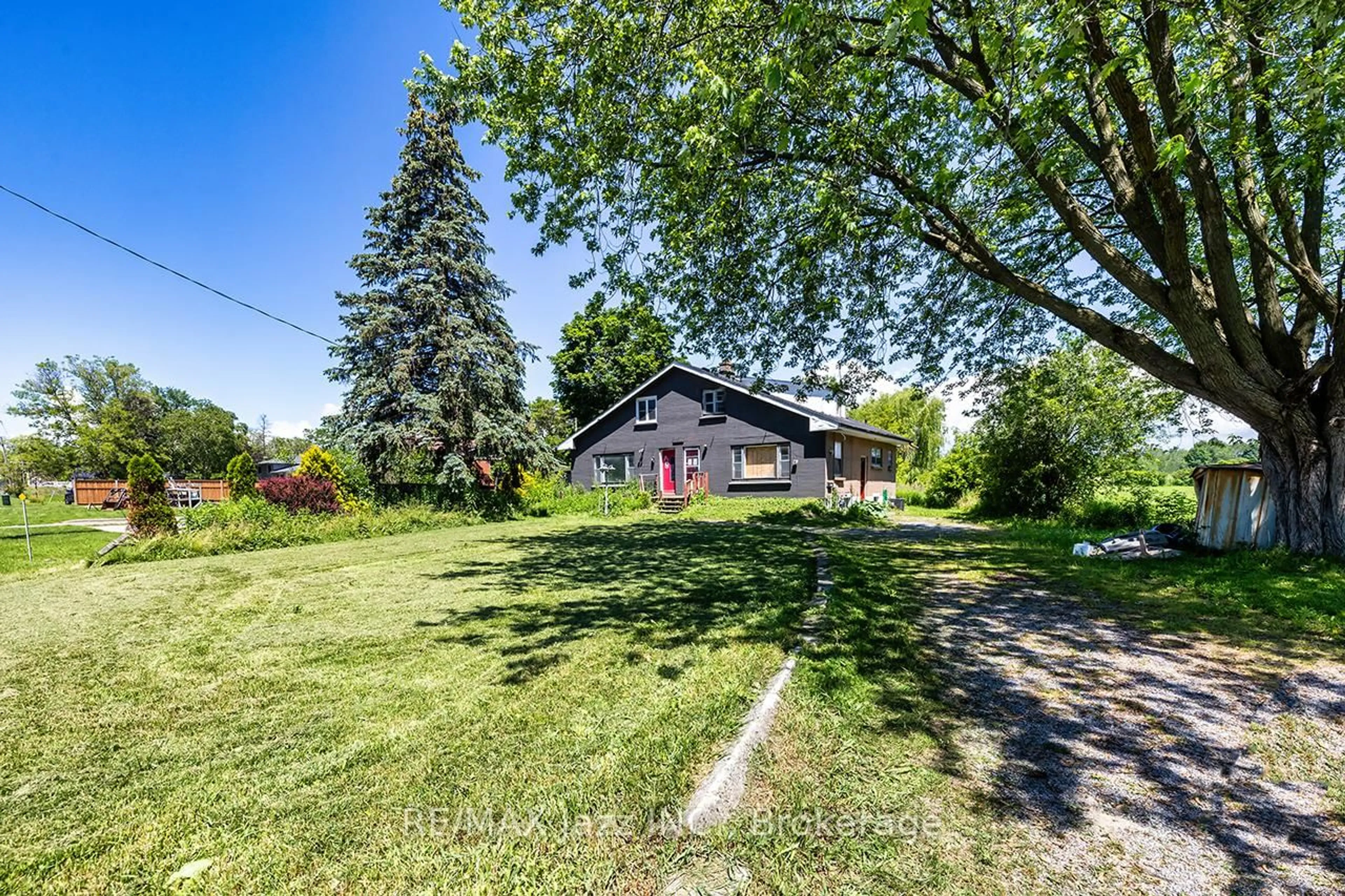 A pic from outside/outdoor area/front of a property/back of a property/a pic from drone, street for 2216 Highway 2, Clarington Ontario L1C 6C3