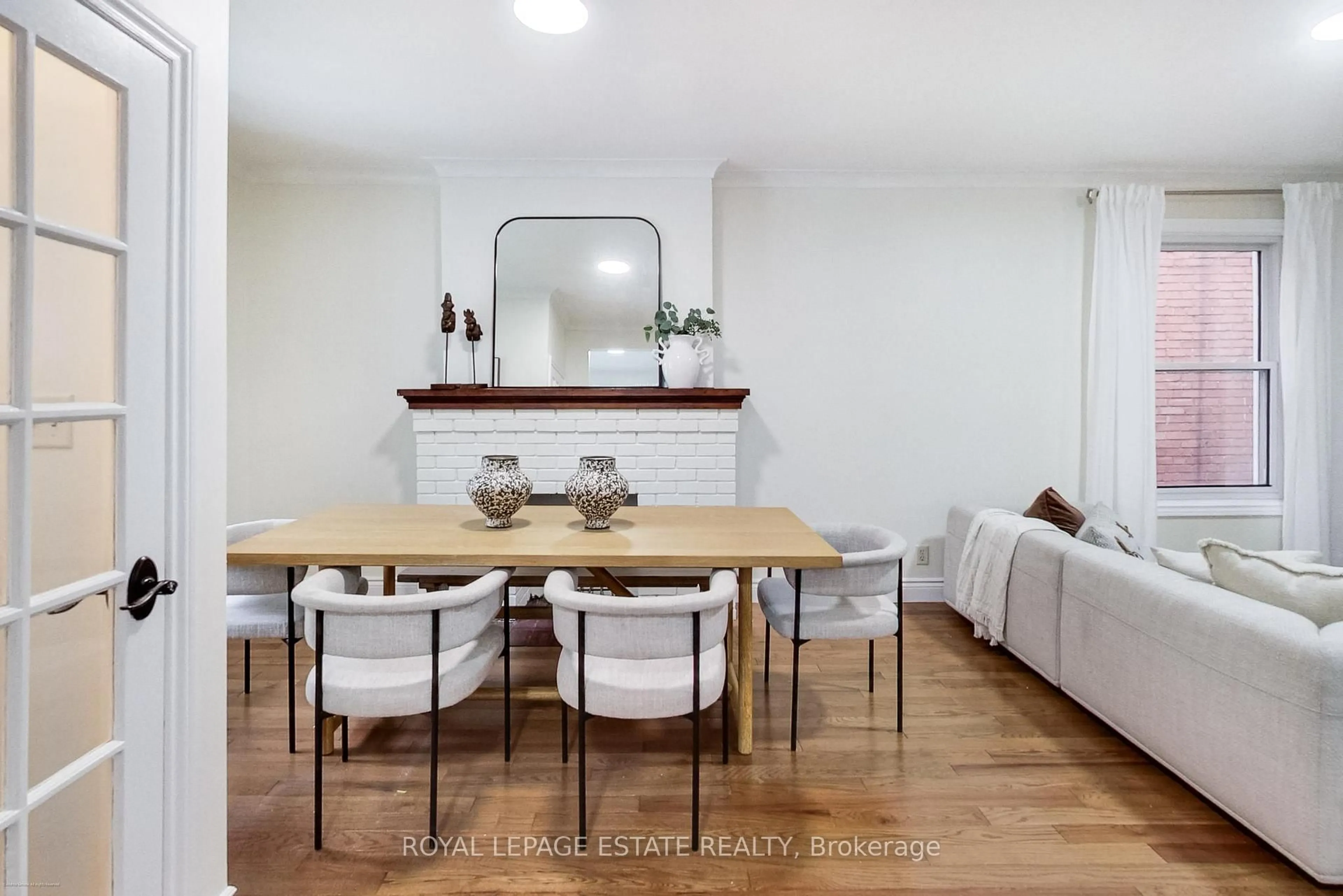 Dining room, wood/laminate floor for 237 Glebemount Ave, Toronto Ontario M4C 3T5