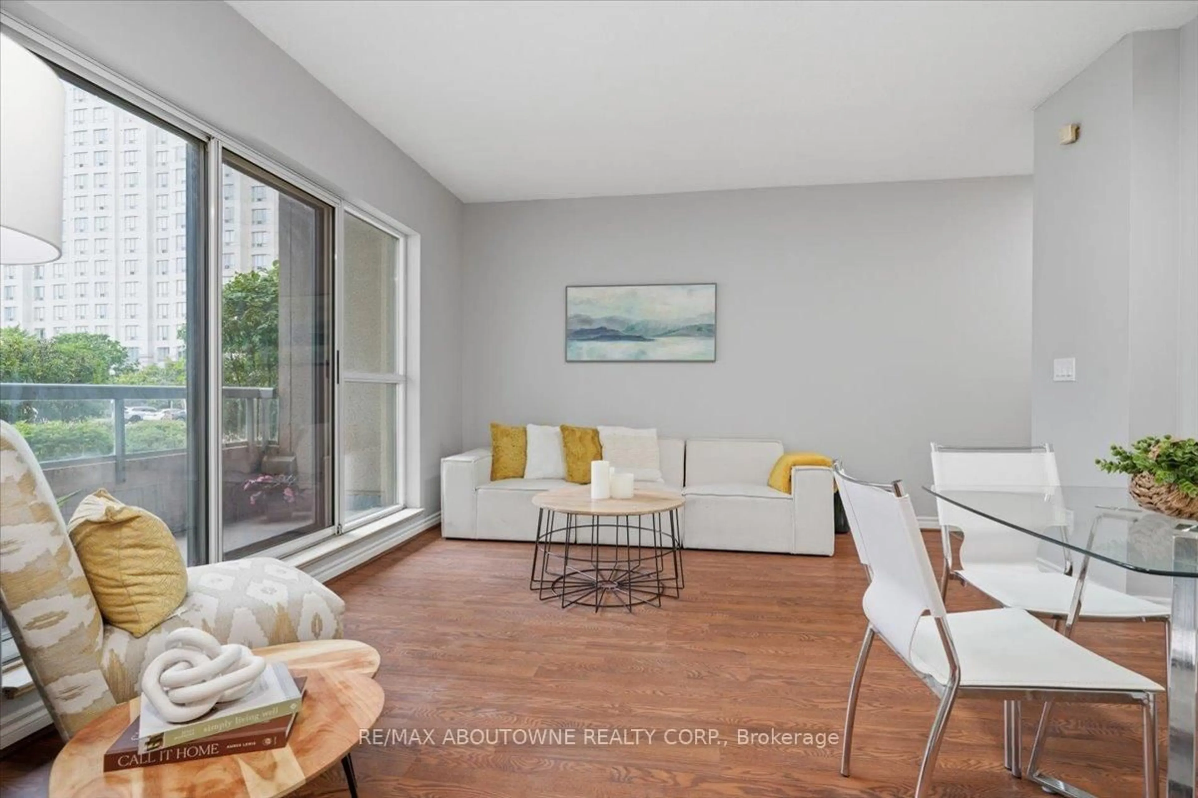Living room with furniture, wood/laminate floor for 5039 Finch Ave #108, Toronto Ontario M1S 5L6
