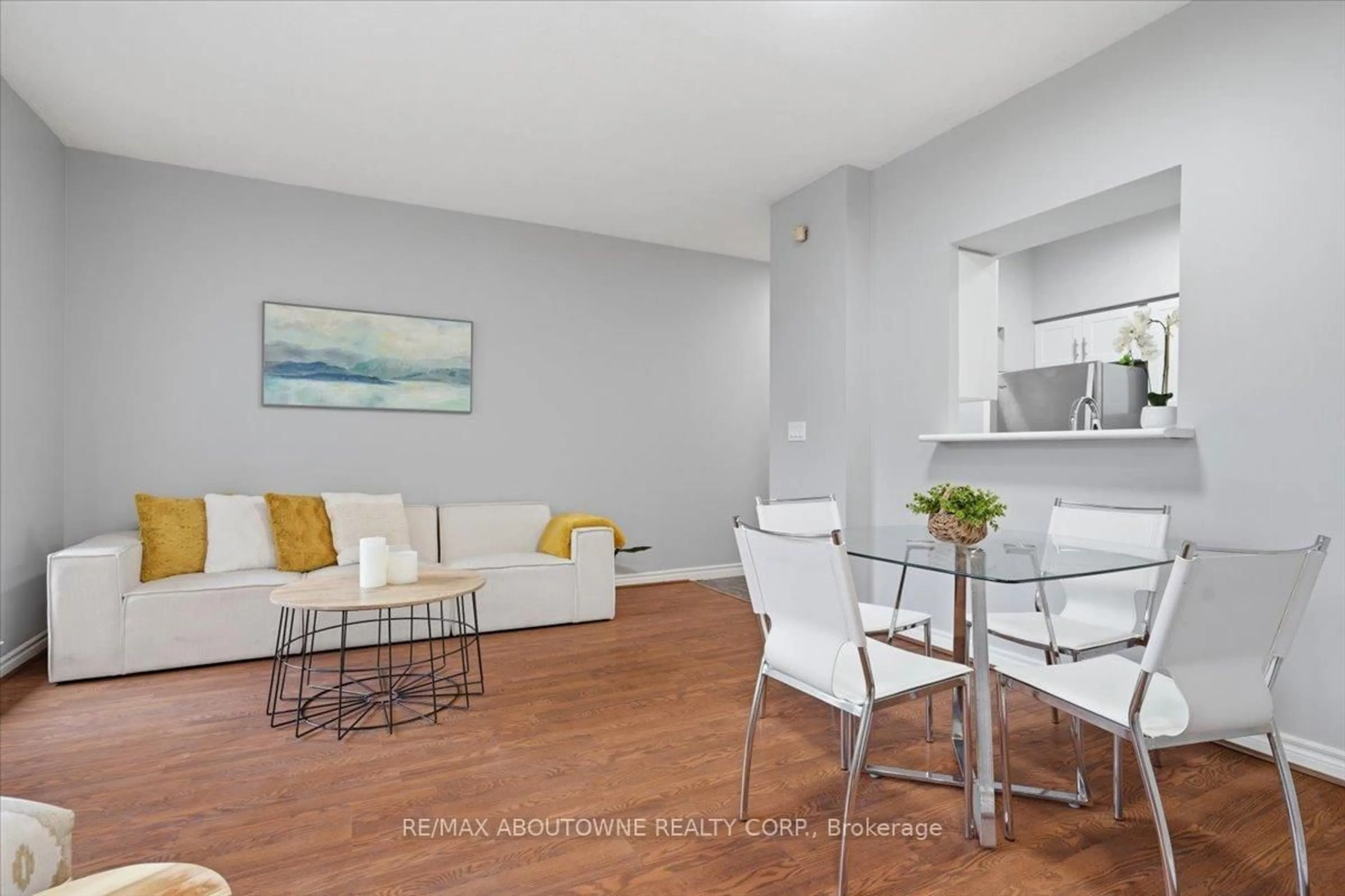 Living room with furniture, wood/laminate floor for 5039 Finch Ave #108, Toronto Ontario M1S 5L6
