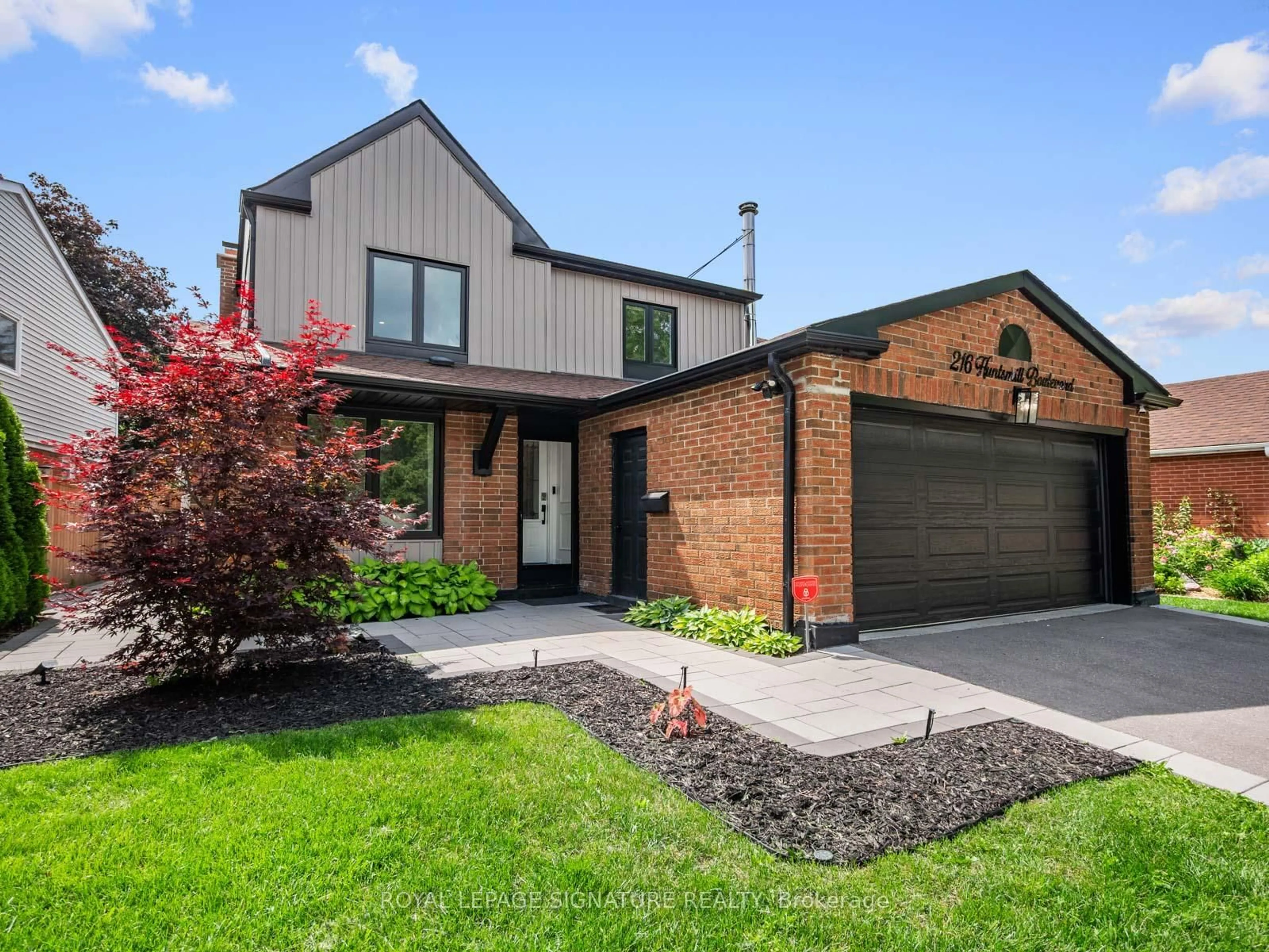Home with brick exterior material, street for 216 Huntsmill Blvd, Toronto Ontario M1W 3E1