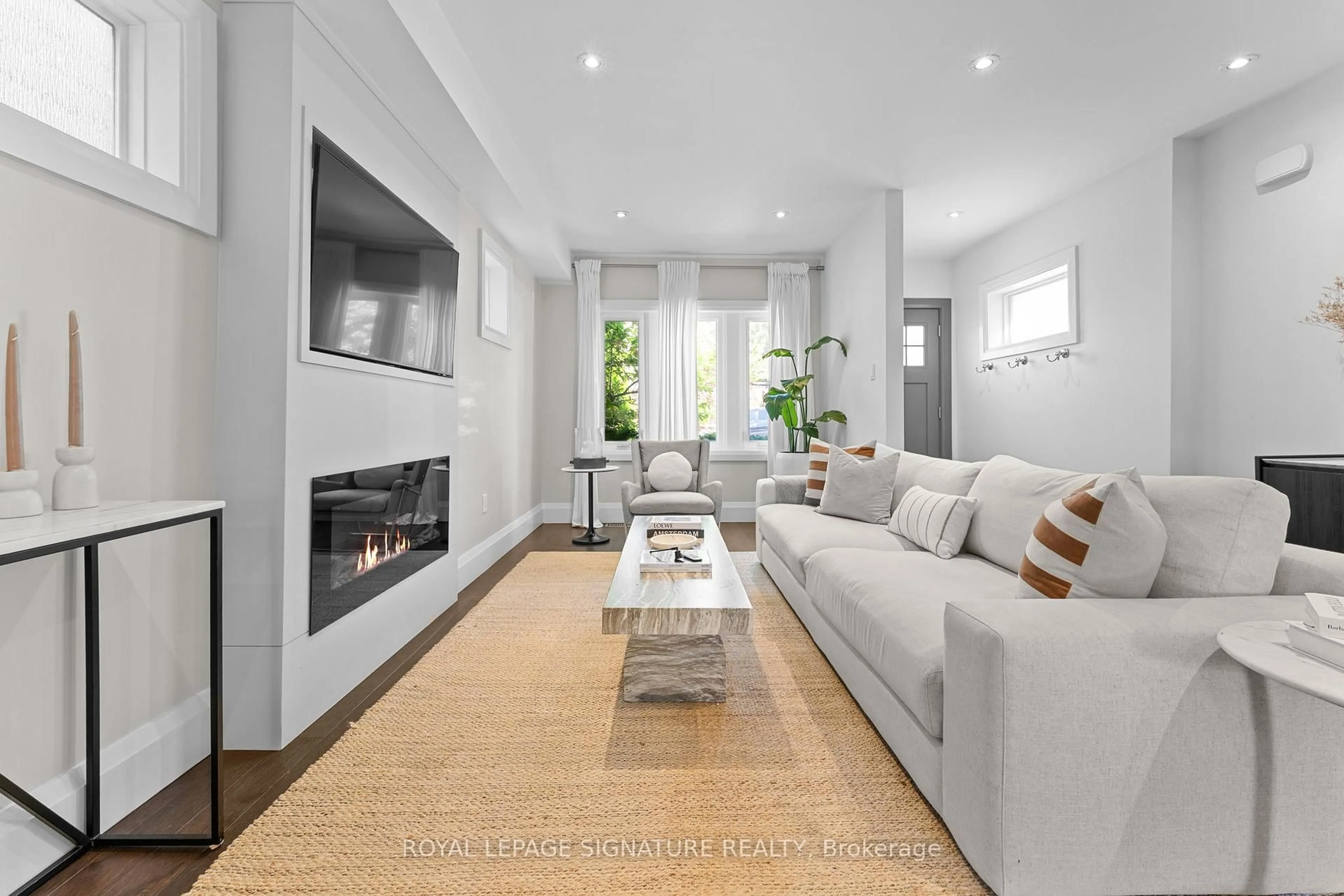 Living room with furniture, unknown for 113 Merrill Ave, Toronto Ontario M4C 1C8