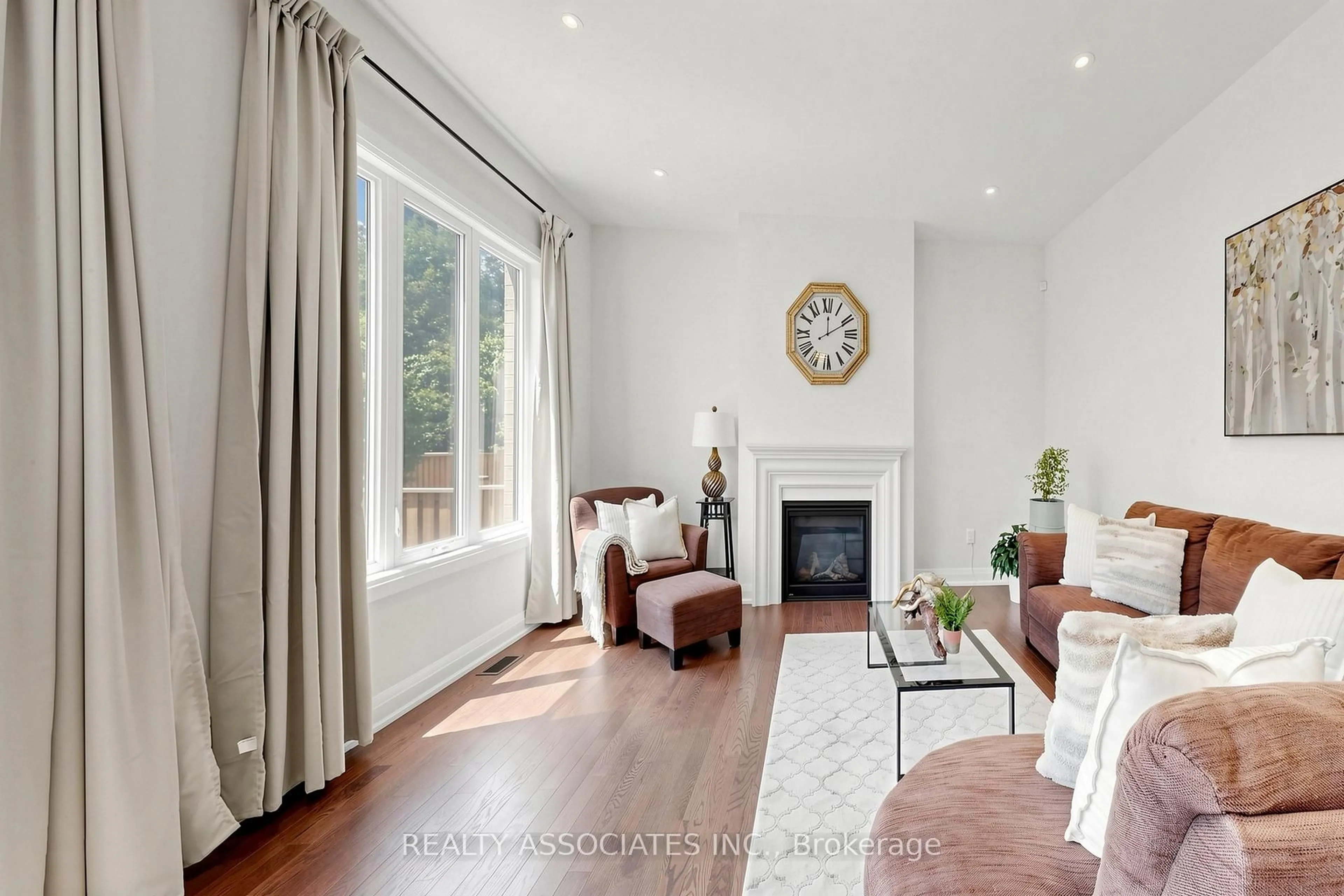 Living room with furniture, wood/laminate floor for 4029 Ellesmere Rd, Toronto Ontario M1C 1J3