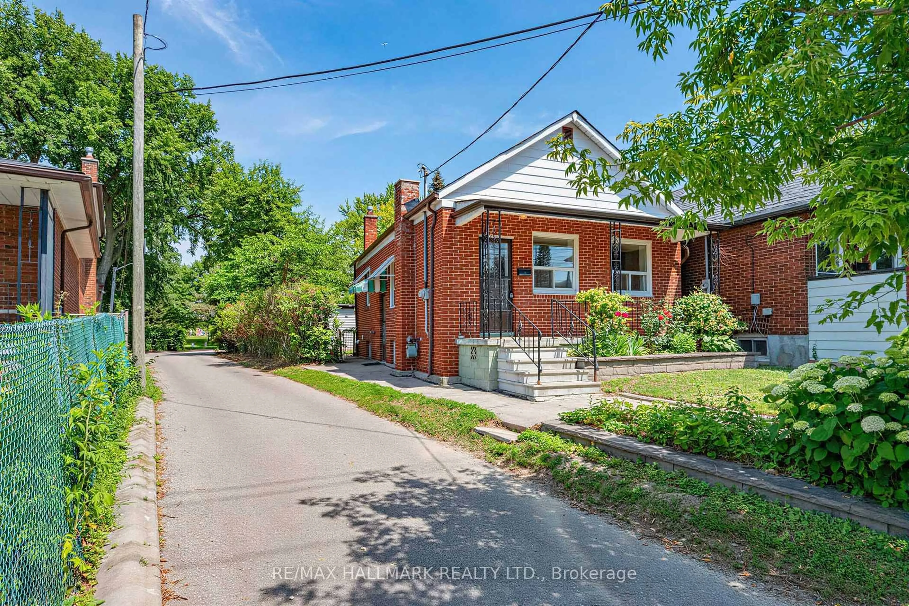 Home with brick exterior material, street for 970 Cosburn Ave, Toronto Ontario M4C 2W9