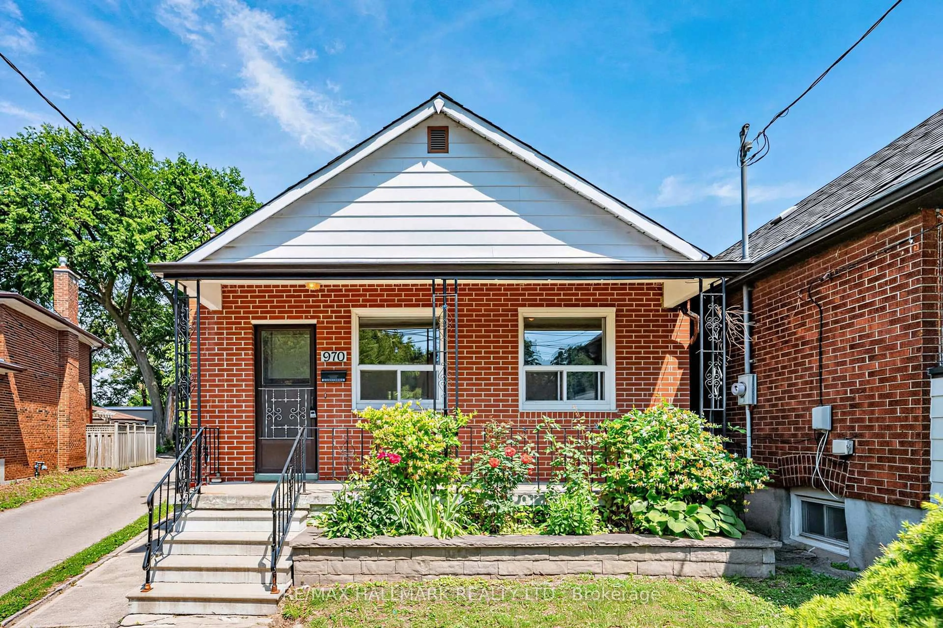 Home with brick exterior material, street for 970 Cosburn Ave, Toronto Ontario M4C 2W9
