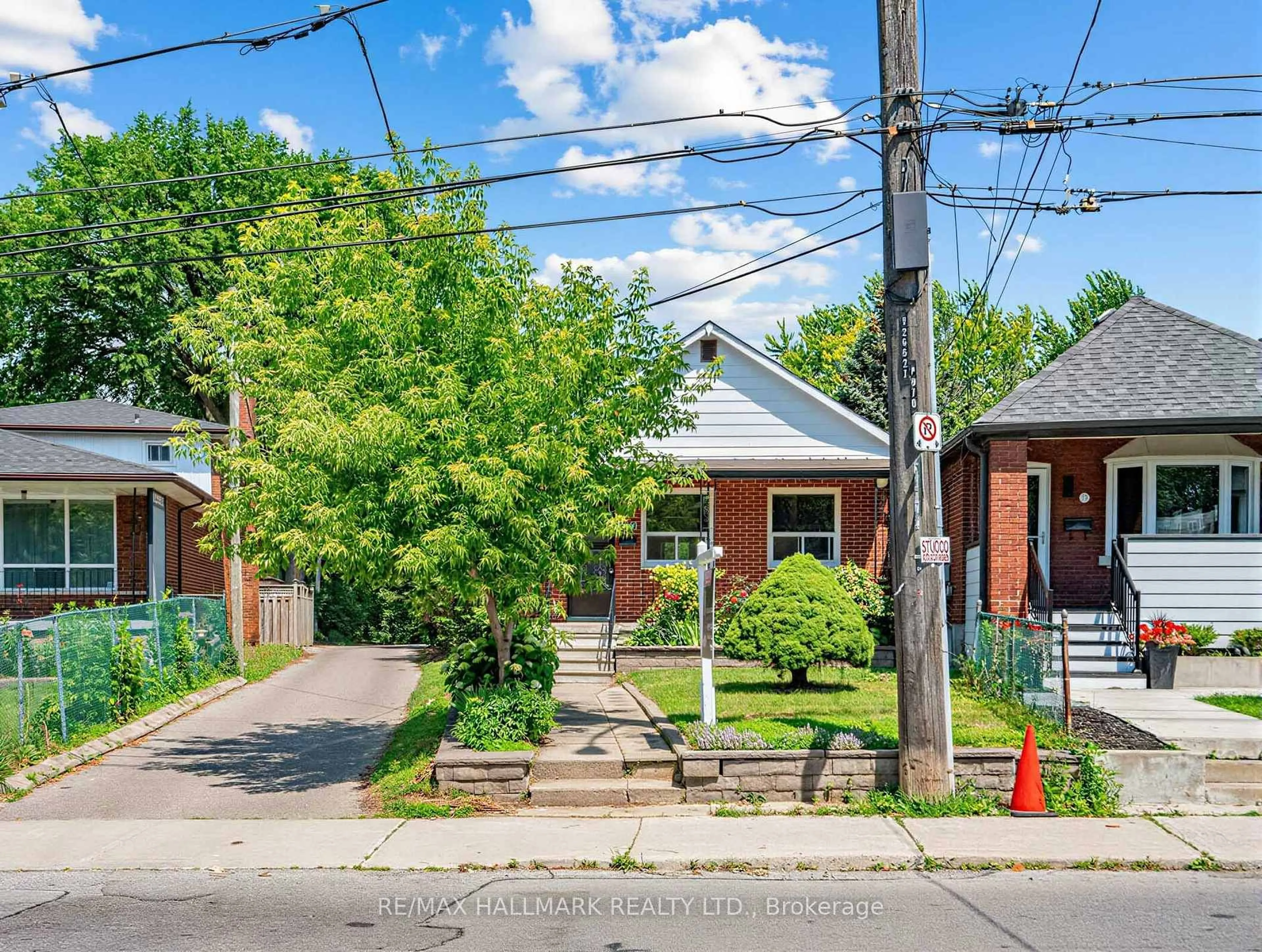 Home with brick exterior material, street for 970 Cosburn Ave, Toronto Ontario M4C 2W9