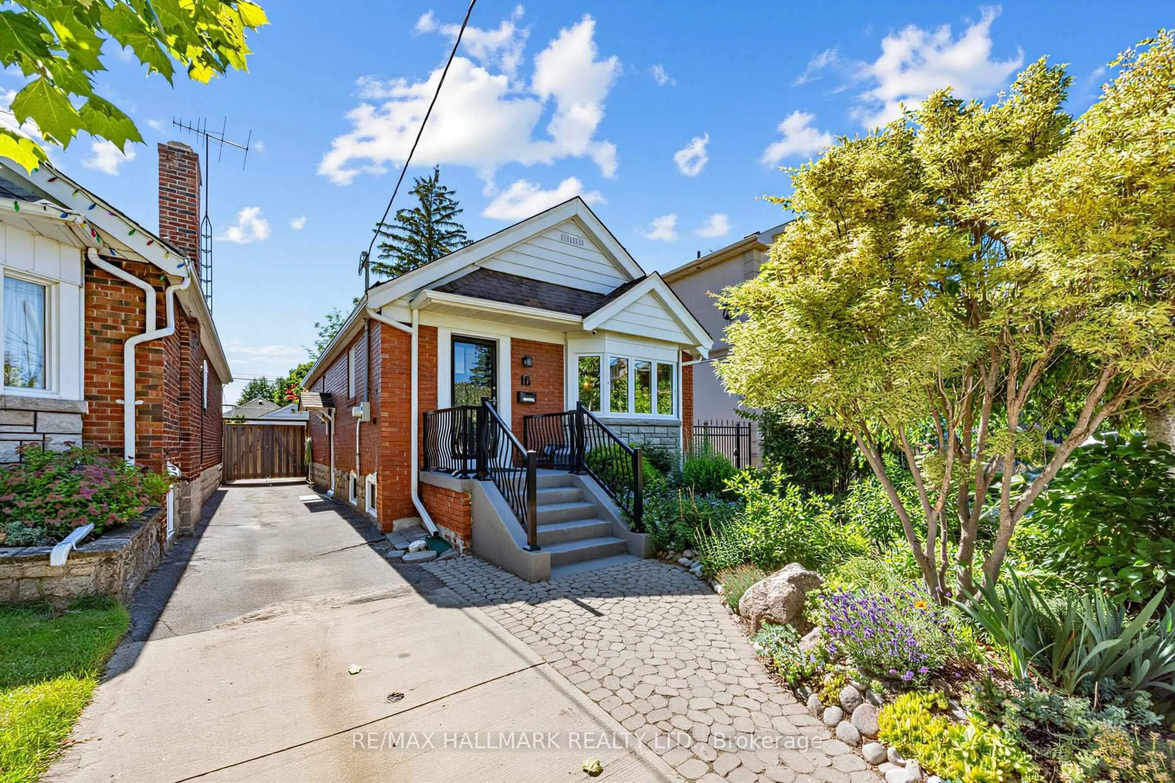 Home with brick exterior material, street for 16 Crestland Ave, Toronto Ontario M4C 3L1