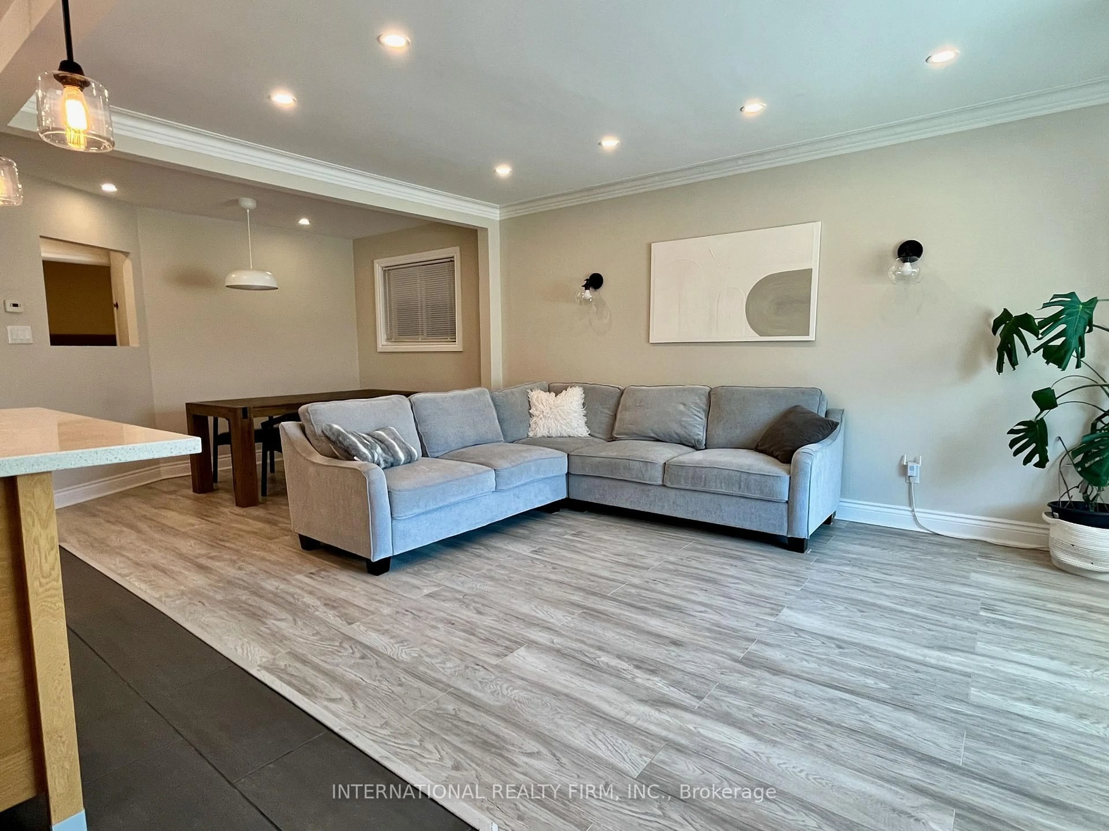 Living room with furniture, unknown for 688 Sammon Ave, Toronto Ontario M4C 2E4