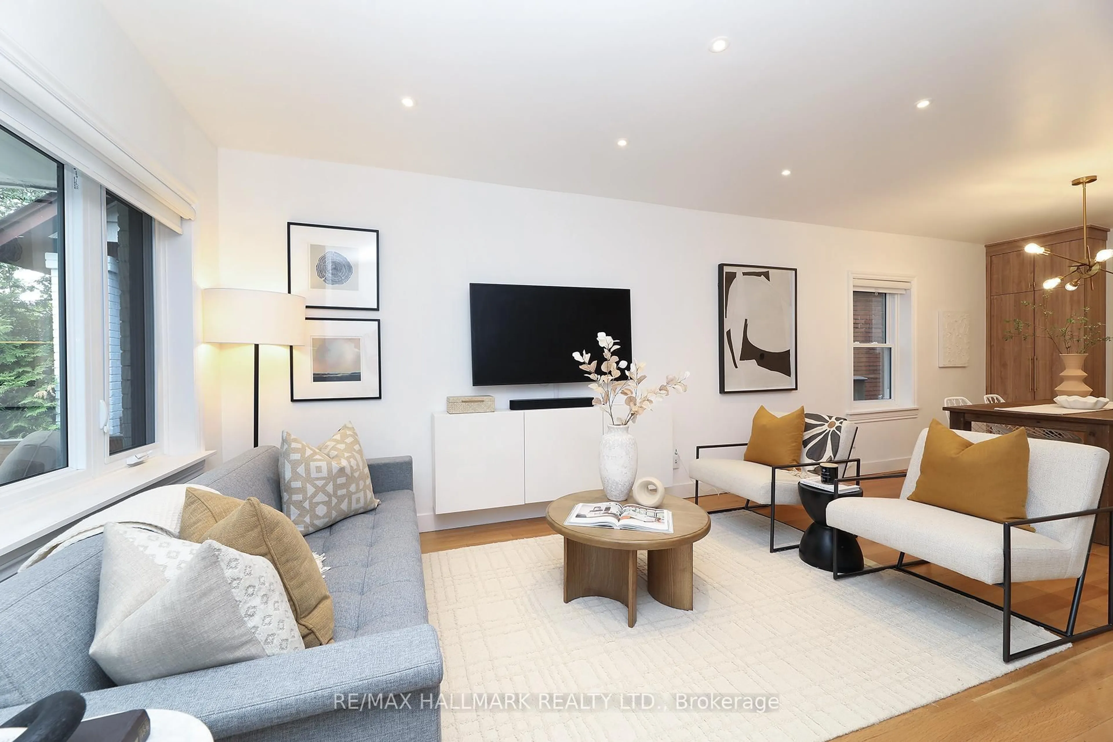 Living room with furniture, wood/laminate floor for 339 Scarborough Rd, Toronto Ontario M4E 3M9