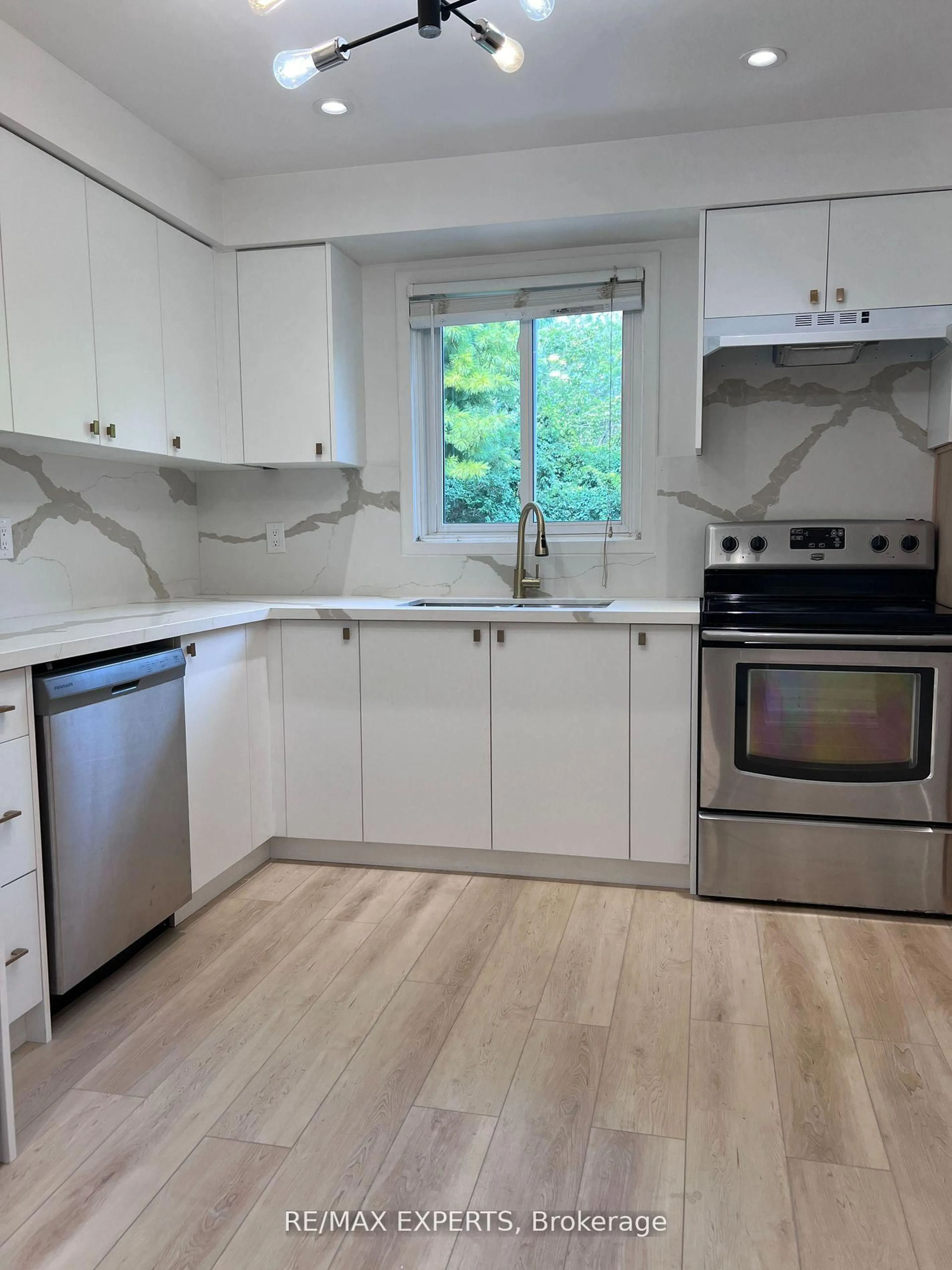 Open concept kitchen, wood/laminate floor for 103 Guthrie Cres, Whitby Ontario L1P 1A6