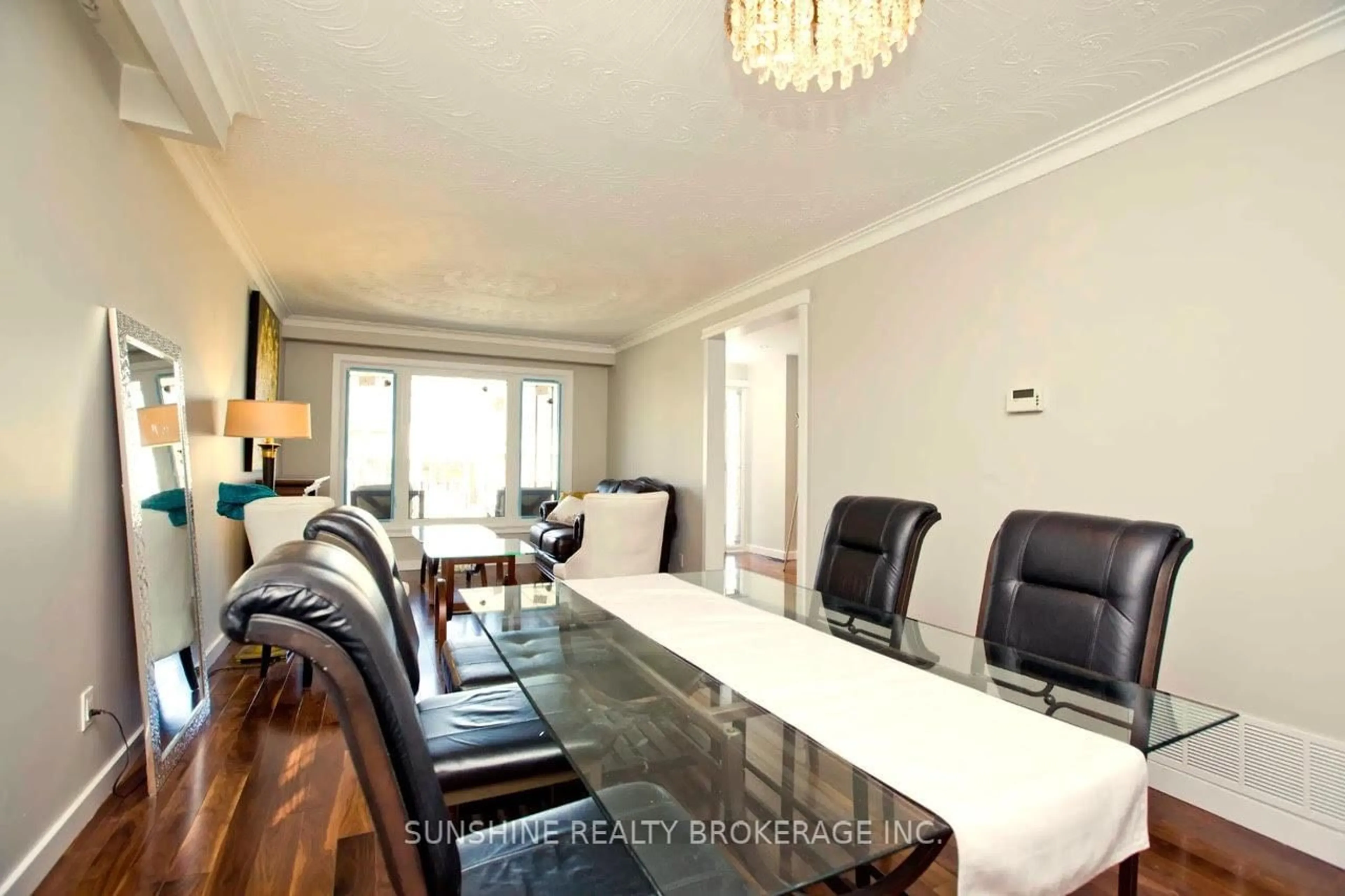 Dining room, wood/laminate floor for 121 Sammon Ave, Toronto Ontario M4J 1Y9