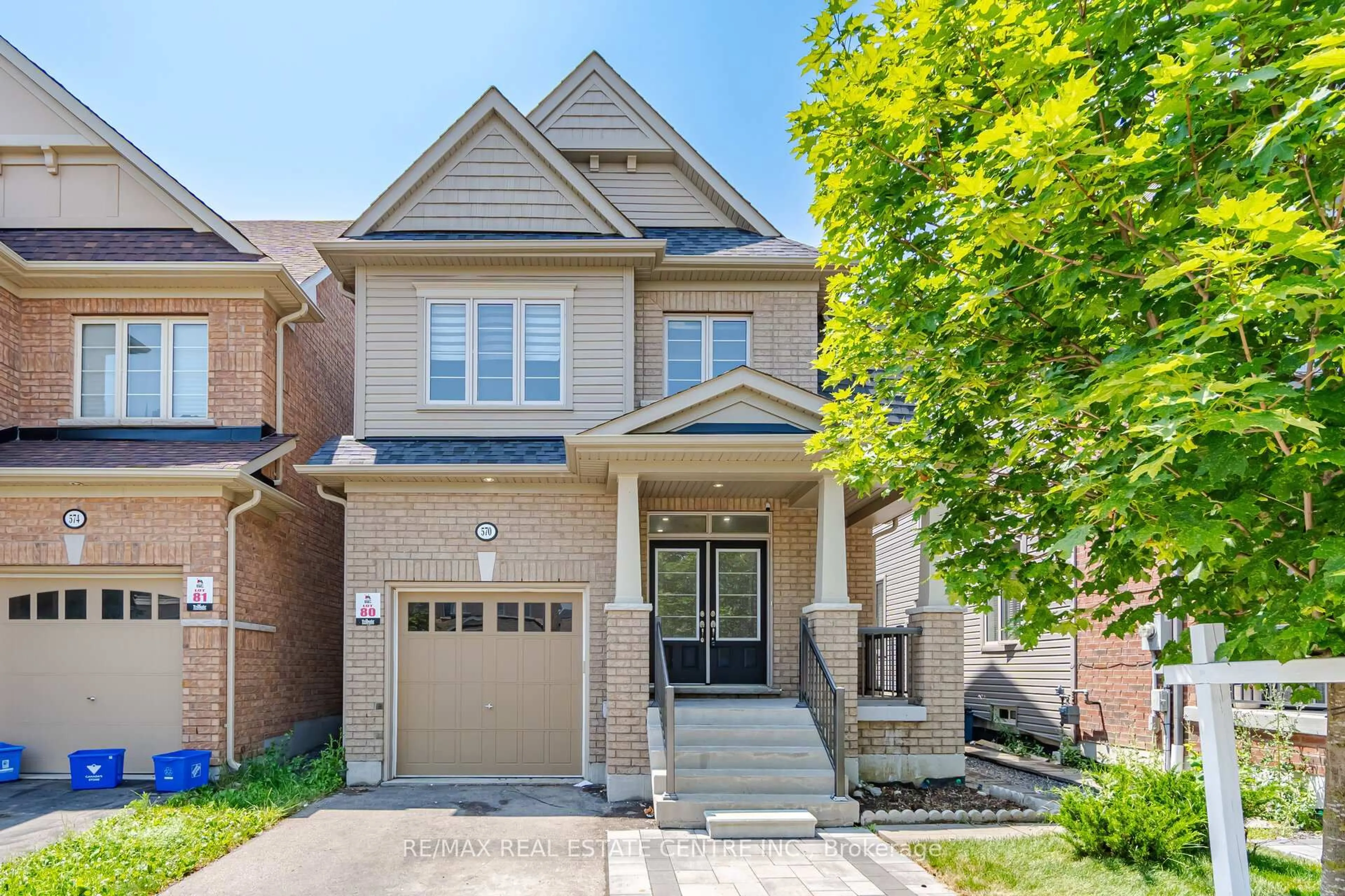 Home with brick exterior material, street for 570 Windfields Farm Dr, Oshawa Ontario L1L 0L8