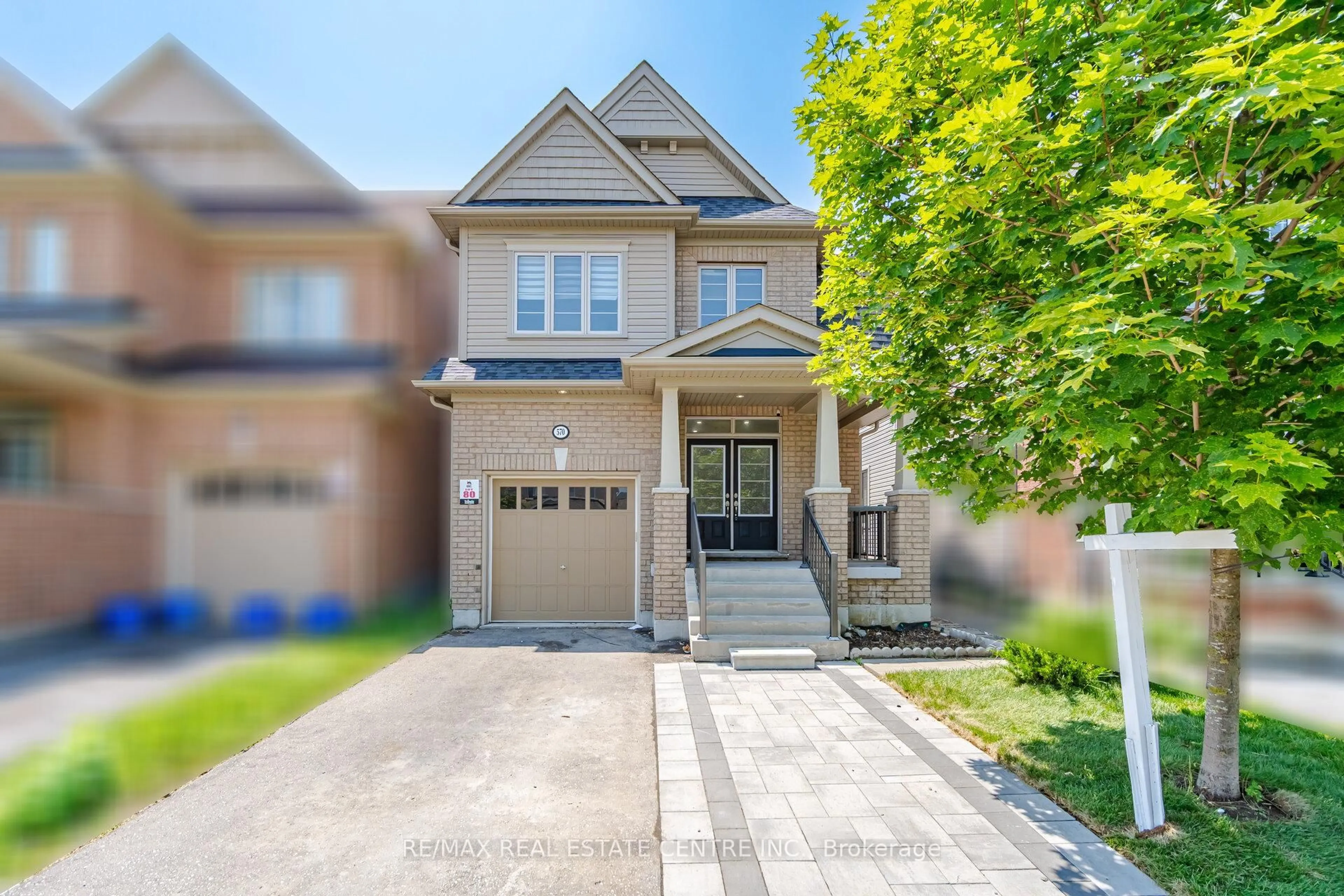 Home with brick exterior material, street for 570 Windfields Farm Dr, Oshawa Ontario L1L 0L8