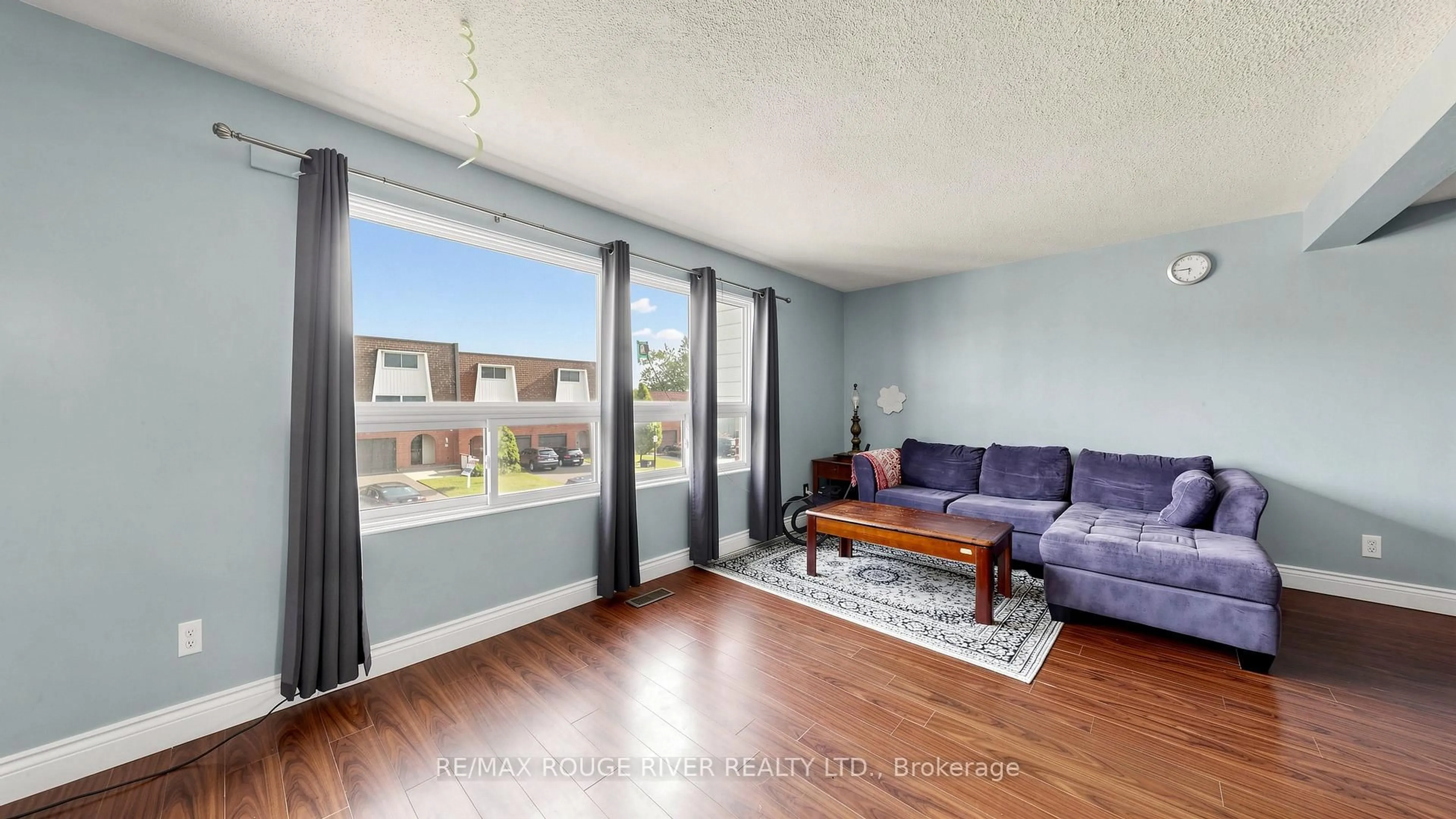 Living room with furniture, wood/laminate floor for 121 Deacon Lane, Ajax Ontario L1S 2T4
