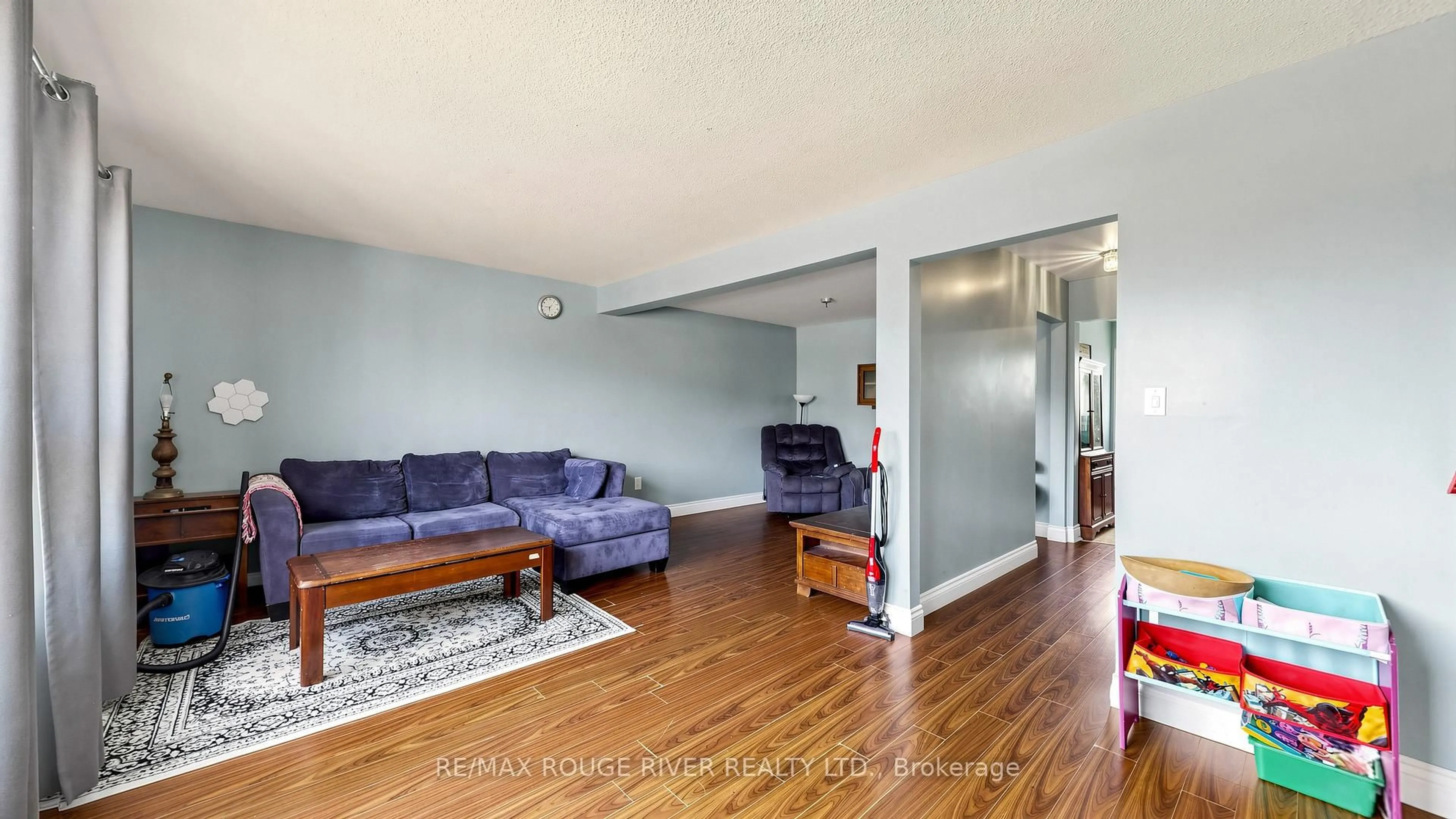 Living room with furniture, wood/laminate floor for 121 Deacon Lane, Ajax Ontario L1S 2T4