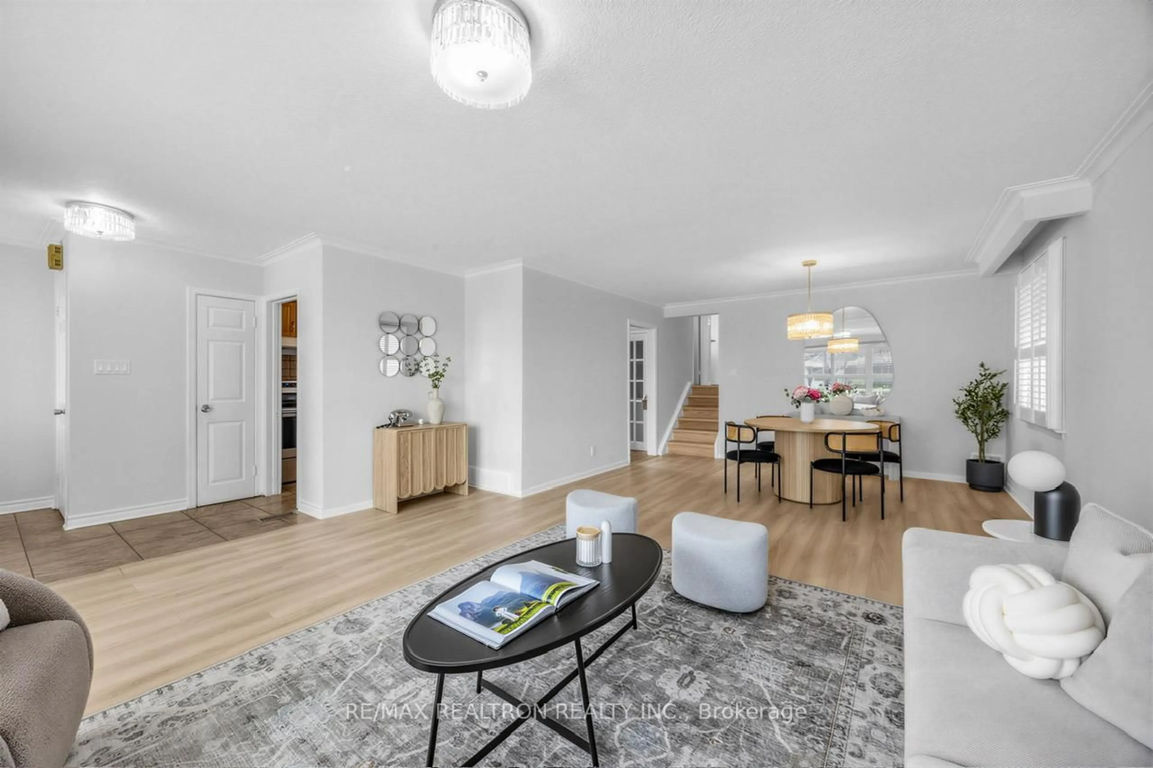 Living room with furniture, wood/laminate floor for 34 Marilake Dr, Toronto Ontario M1S 1V7