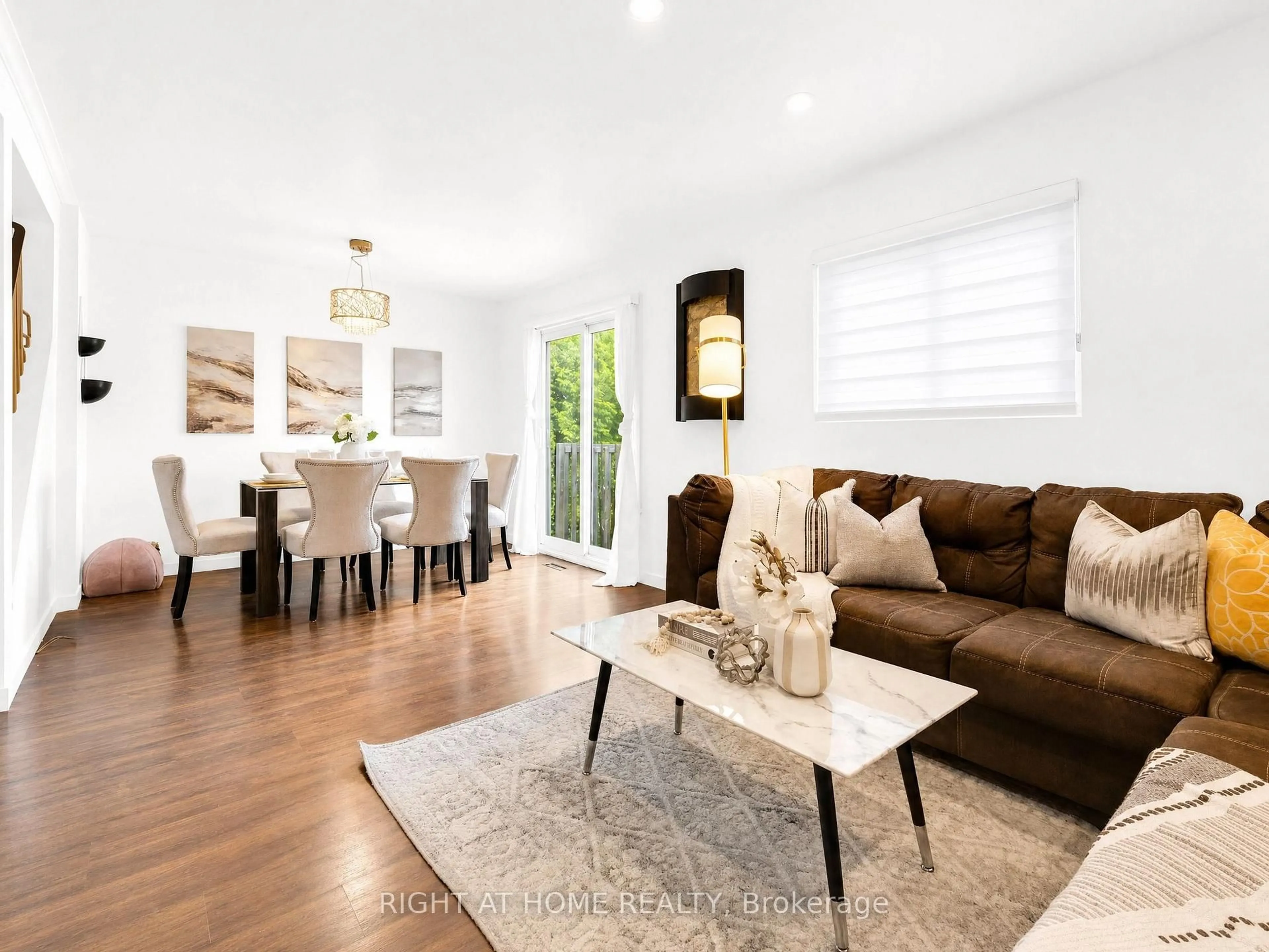 Living room with furniture, wood/laminate floor for 1055 Central Park Blvd ##4, Oshawa Ontario L1G 7M4