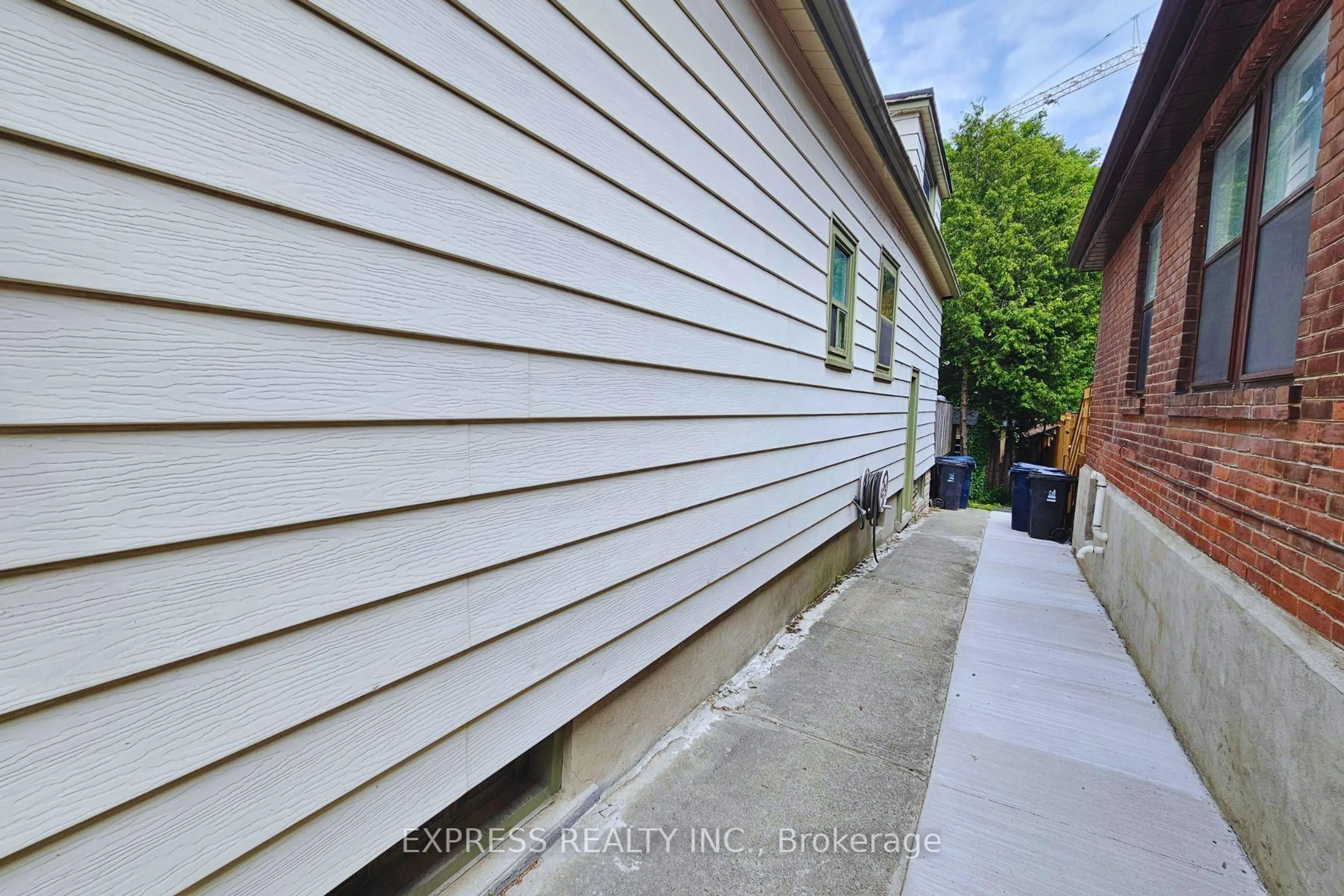 A pic from outside/outdoor area/front of a property/back of a property/a pic from drone, street for 9 Bryant Ave, Toronto Ontario M4C 5G9
