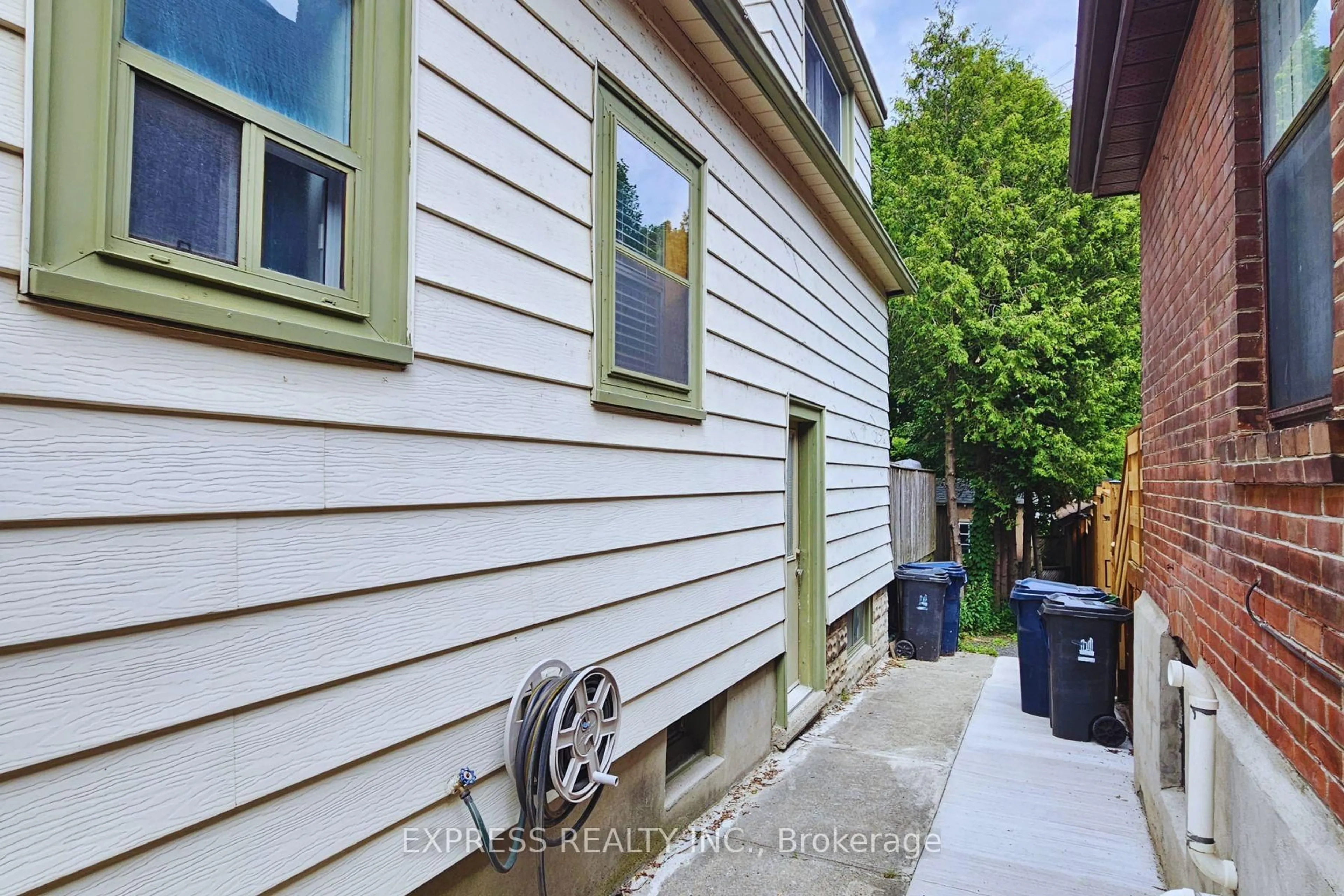 Home with vinyl exterior material, street for 9 Bryant Ave, Toronto Ontario M4C 5G9